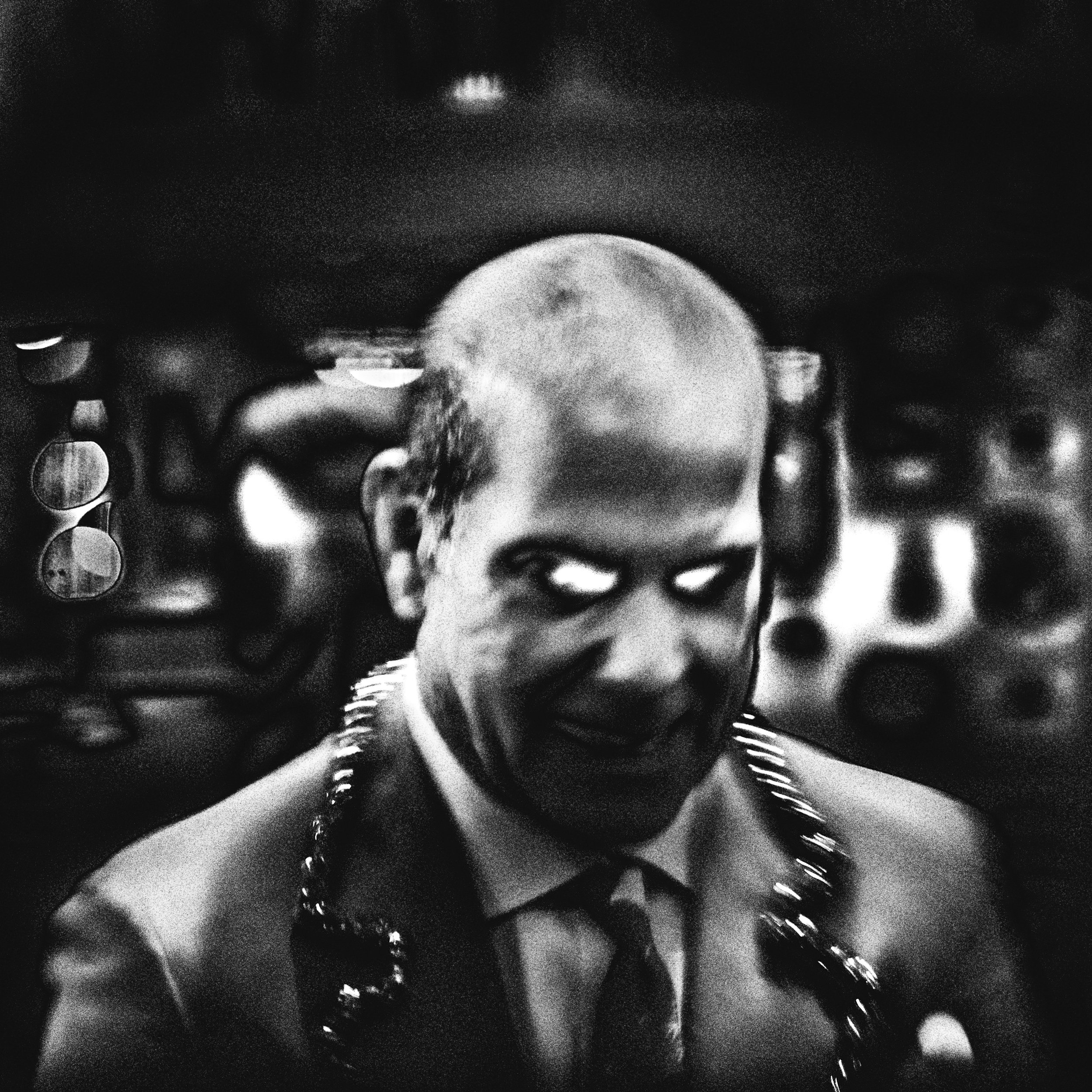 MANIAC, 22’  
Limited Edition of 9 and 3AP  
Signed by the Artist  
17” x 22” | “30 x 40”  
 
 
Digital Photography | A Street-Portrait of Mr. C. | Archival Pigment Print MANIAC is a photograph I shot in 2022 on a snowy evening before Christmas insid