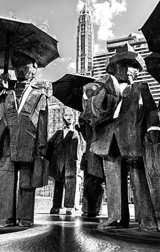 SALARY MEN, 25’ 
 
Limited Edition of 9 and 3AP 
Signed by the Artist 
17” x 22” | “30 x 40” 
 
Digital Photography | A photograph of Ju Ming’s bronze statue, “The Gentlemen” | Archival Pigment Print 
 
“It is perhaps the most appropriately placed st