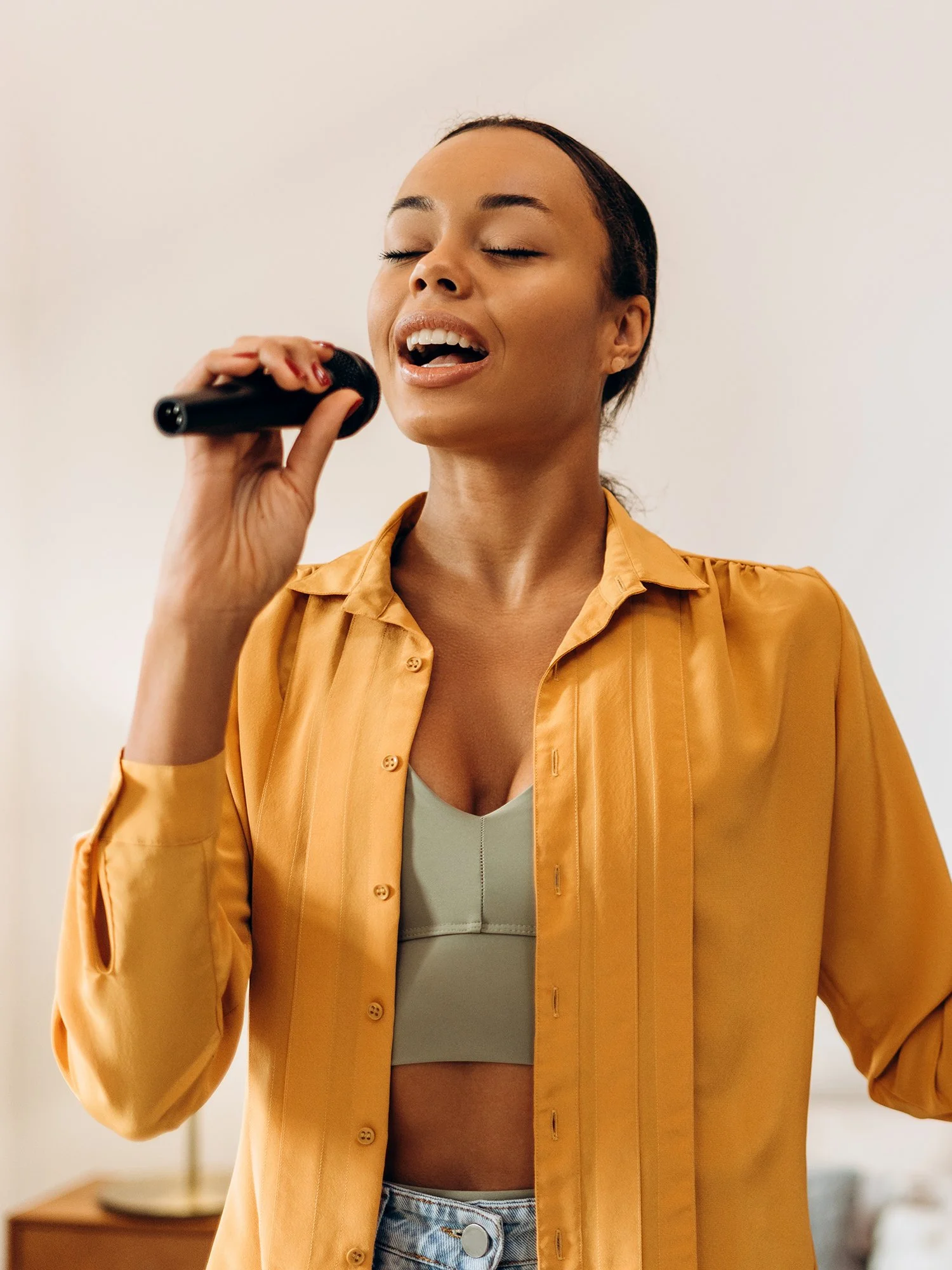 woman with microphone craniosacral therapy for singers