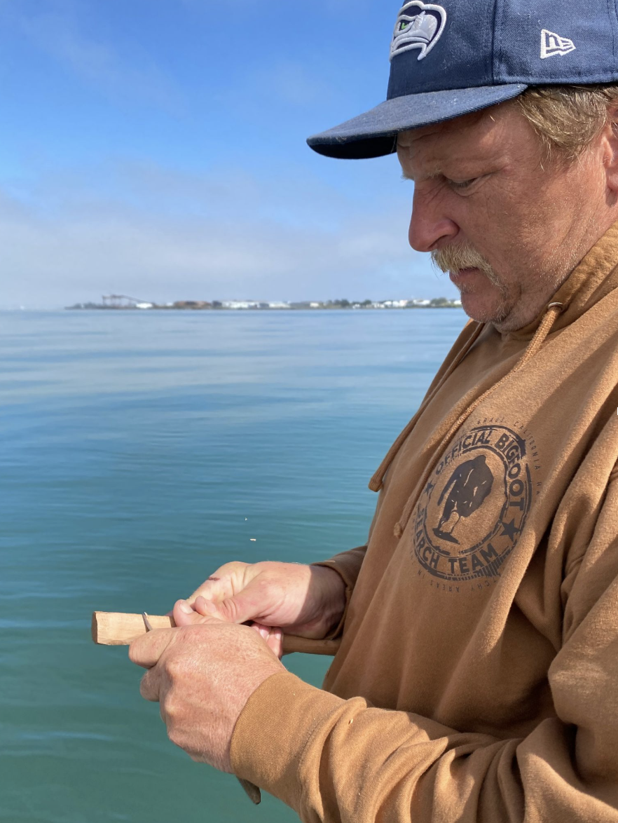 man learning how to spoon carve