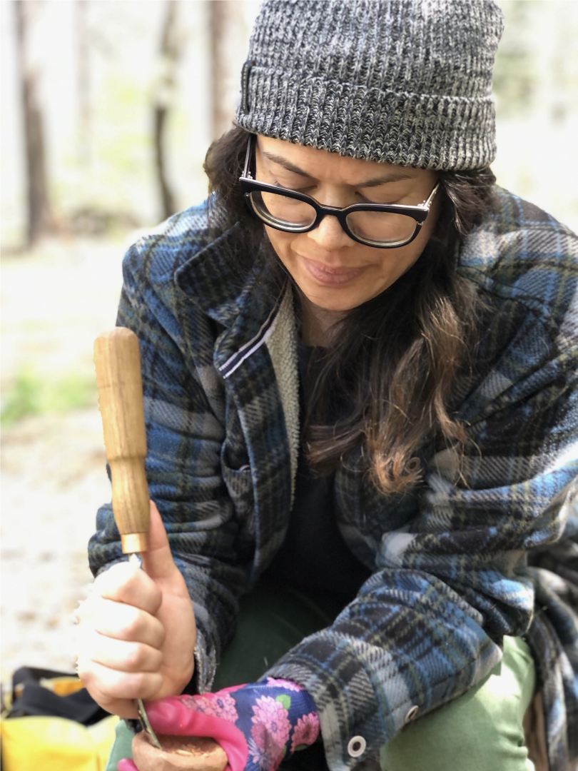 woman spoon carving