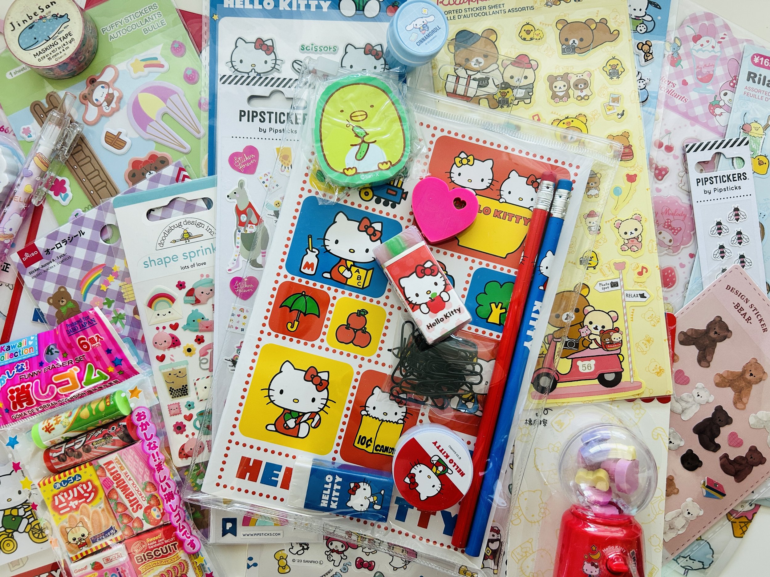 Mega surprise stationery box with 20 pieces of Sanrio, San-X, and kawaii stickers, washi tape, erasers, notepads, pens, pencils, and more.