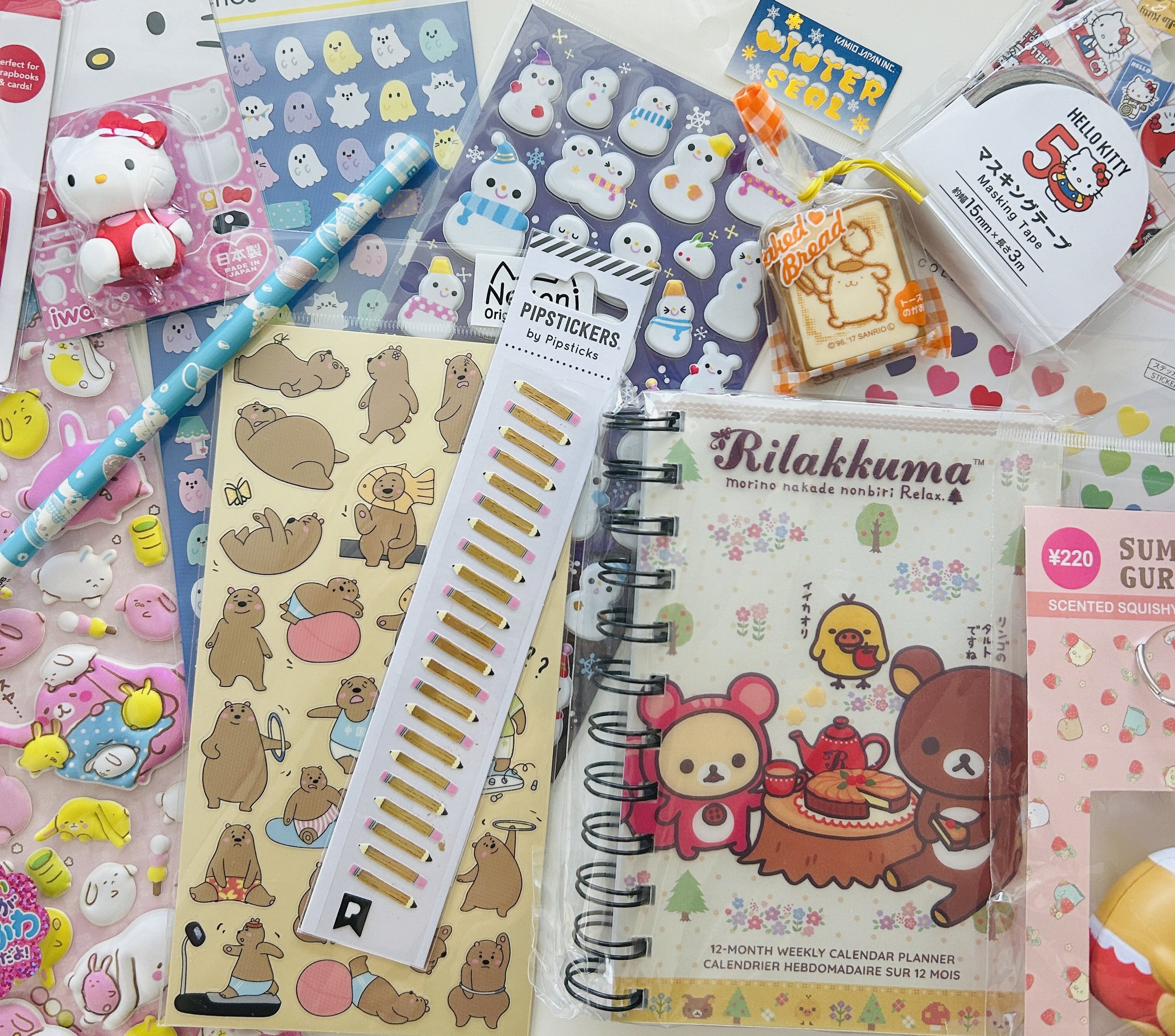 Mega surprise stationery box with 20 pieces of Sanrio, San-X, and kawaii stickers, washi tape, erasers, notepads, pens, pencils, and more.