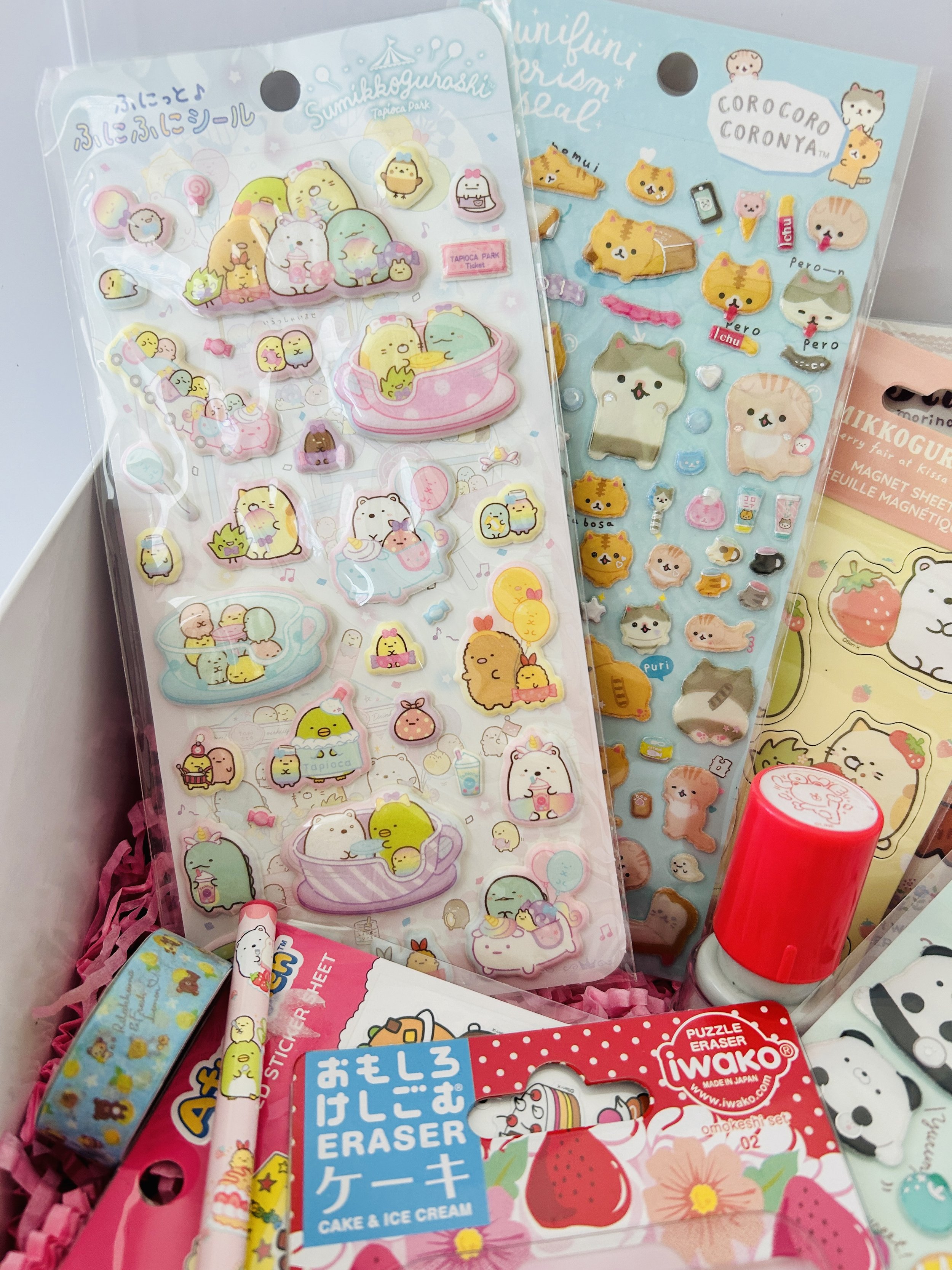 Mini stationery surprise box with Rilakkuma, San-X, and Sanrio stickers, erasers, pens & pencils, washi tape, and more.