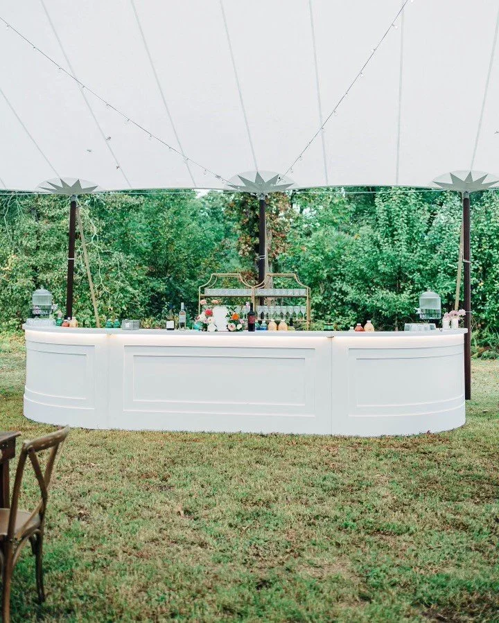 Half-oval bar made from two white bars and one straight bar.