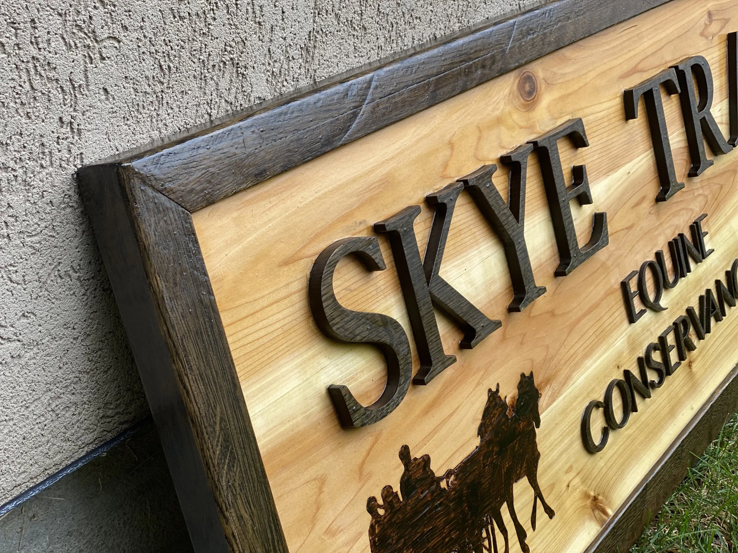 A custom wooden farm sign made for Skye Trace Equestrian Center in Potomac Maryland. The sign is made from cedar and white oak wood.