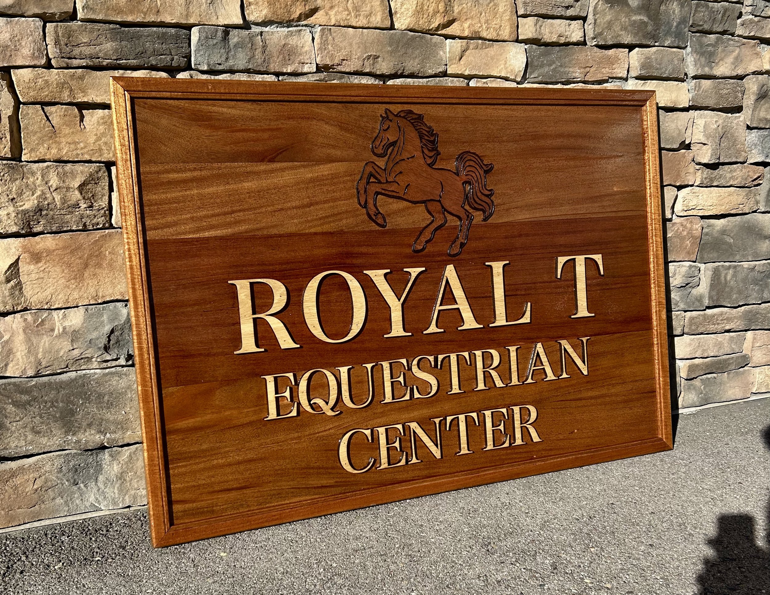 Outdoor business wood sign. Custom Mahogany wood sign that says "Royal T Equestrian Center" in White Oak Lettering