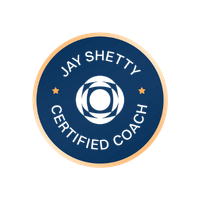 Seal of Jay Shetty Certified Coach with a blue circular design and gold outer ring.