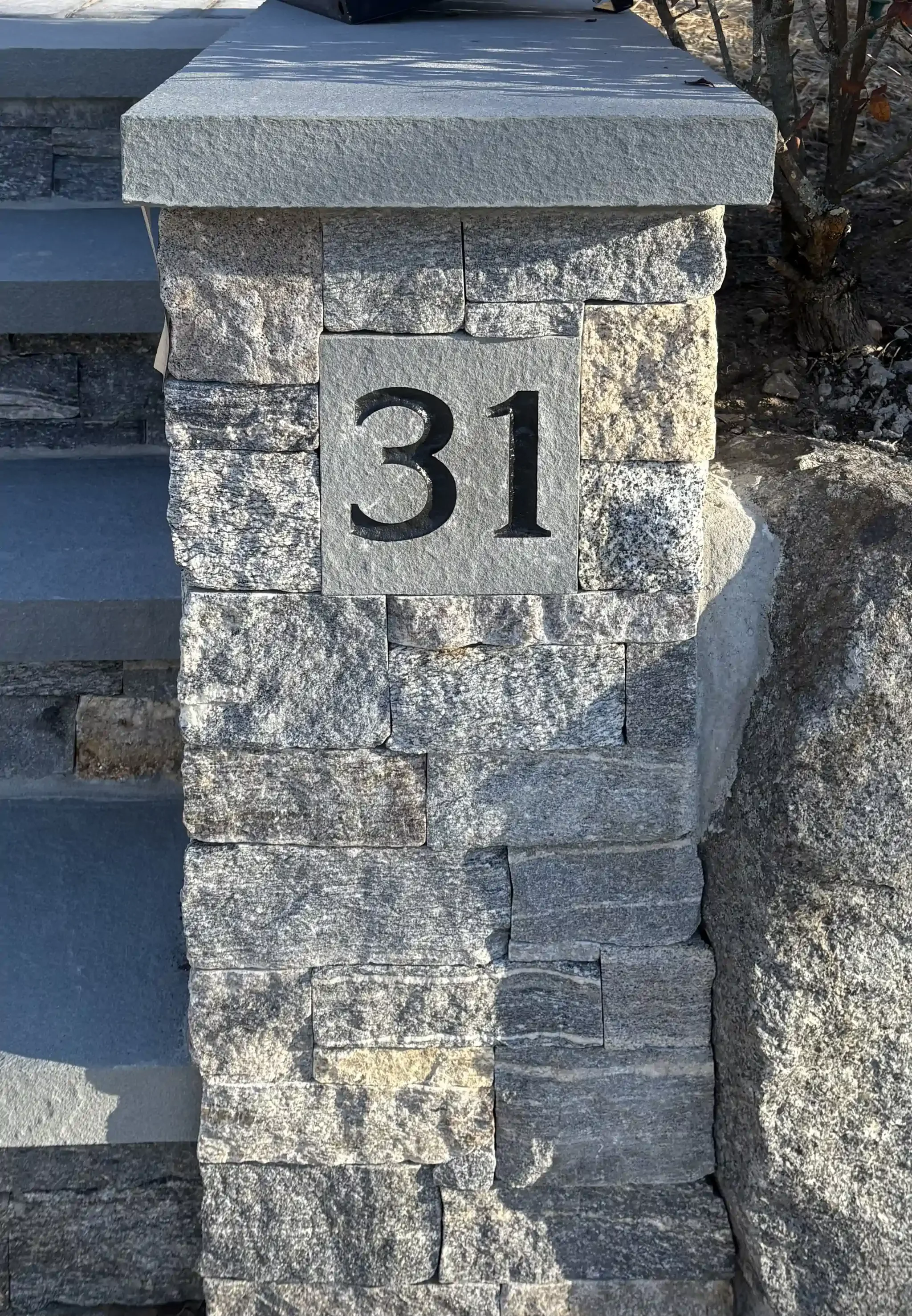 A rectangular address stone.
