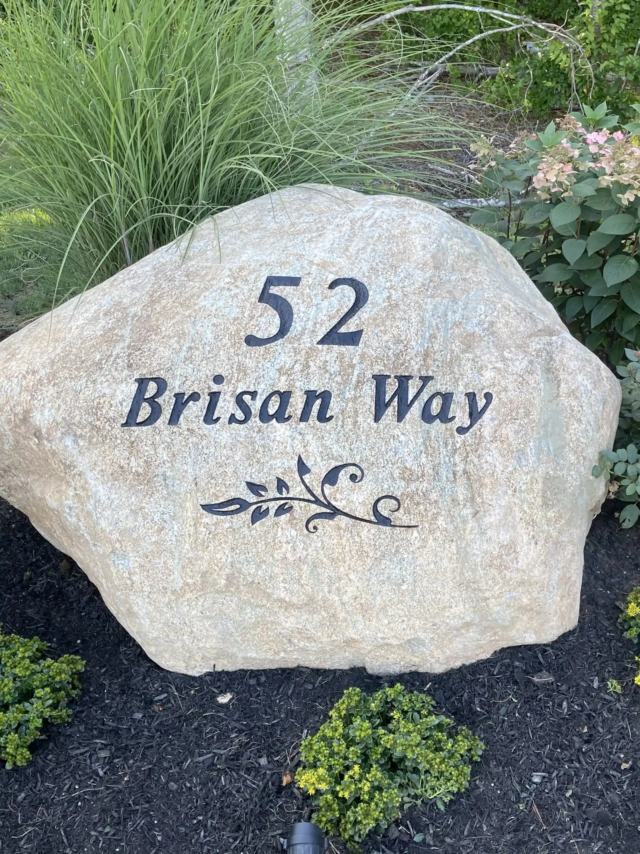 An address boulder with the number 52.