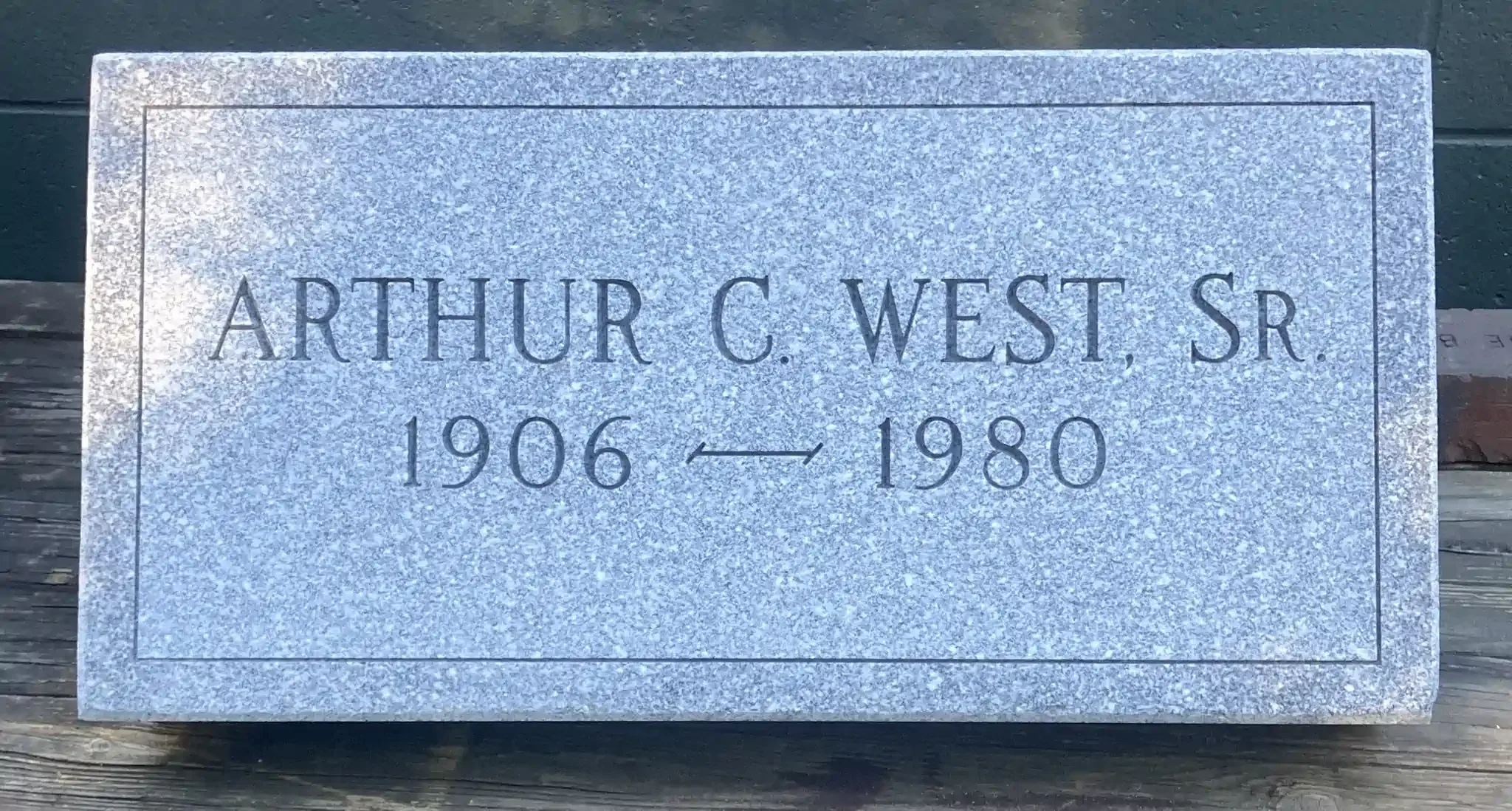 Gravestone with engraved text.