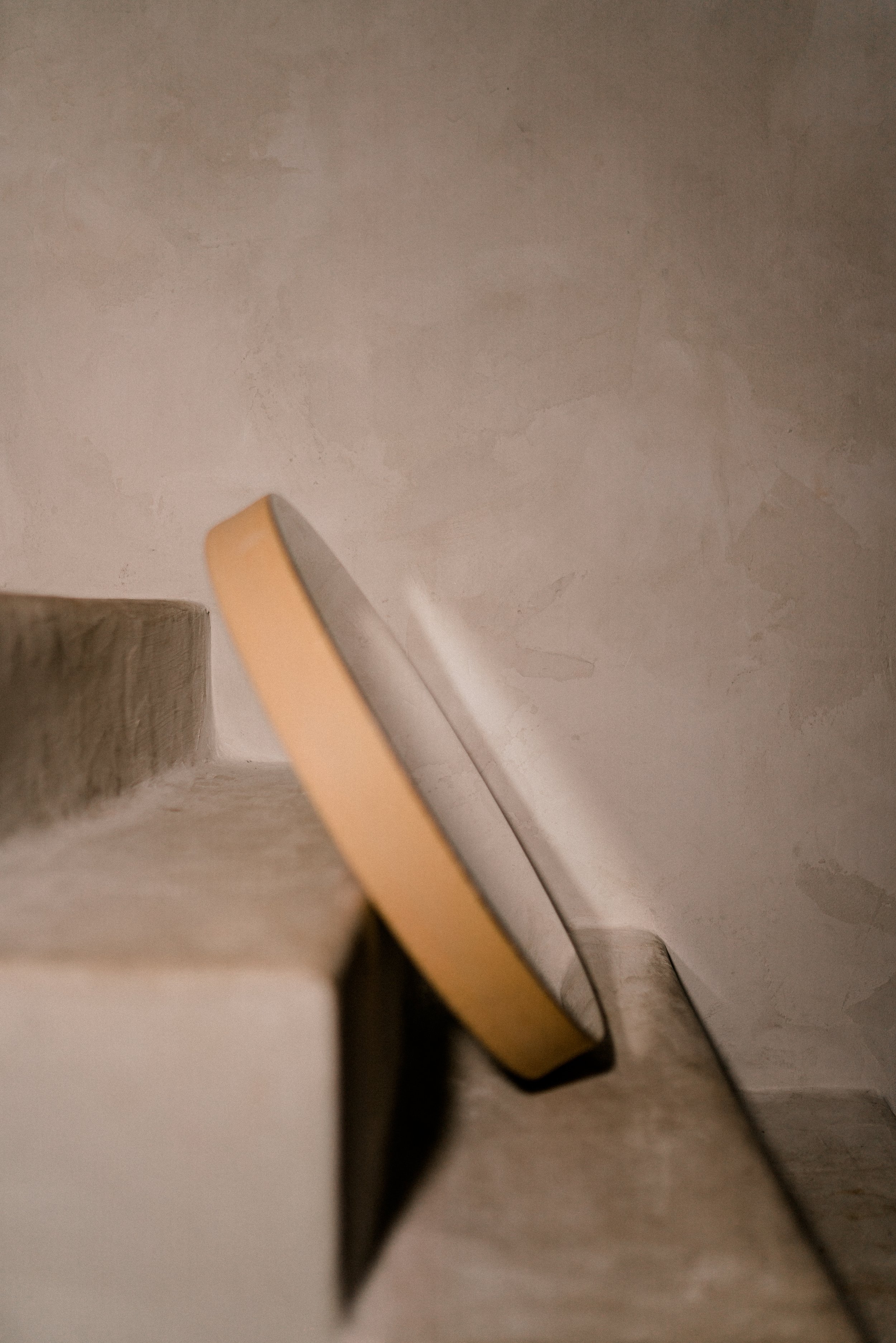 A smartphone leaning against a staircase wall.