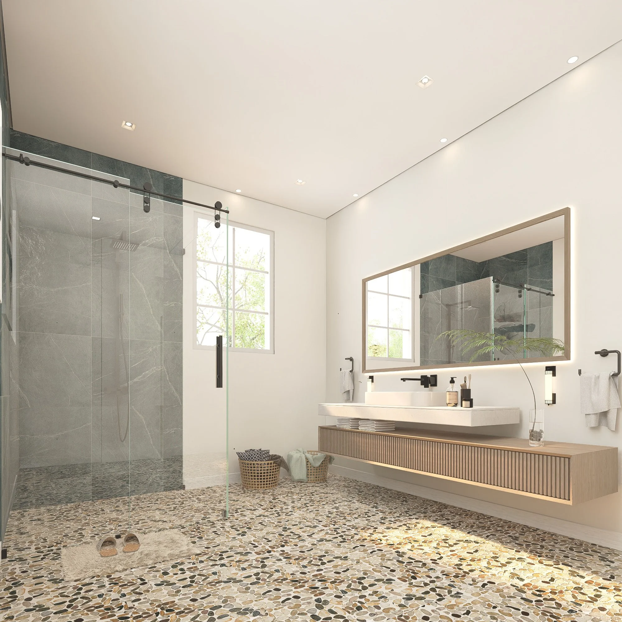 Modern bathroom with large pebble stone floor, walk-in glass shower, white walls, floating wooden vanity, large backlit mirror, and a window showing outdoor greenery.