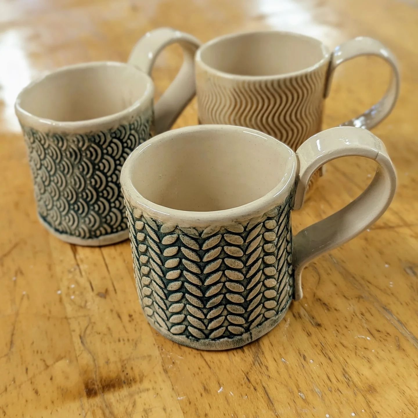 Fresh out of the kiln 💥 Who doesn't like a nice big cuppa ☕? 
Wrapped textured mugs from the October workshop. 

Link in bio for the winter workshops.

#Ceramics #Pottery #ClayArt
#HandmadePottery
#CeramicArt 
#Sculpture #Christmas
#CeramicDesign #C