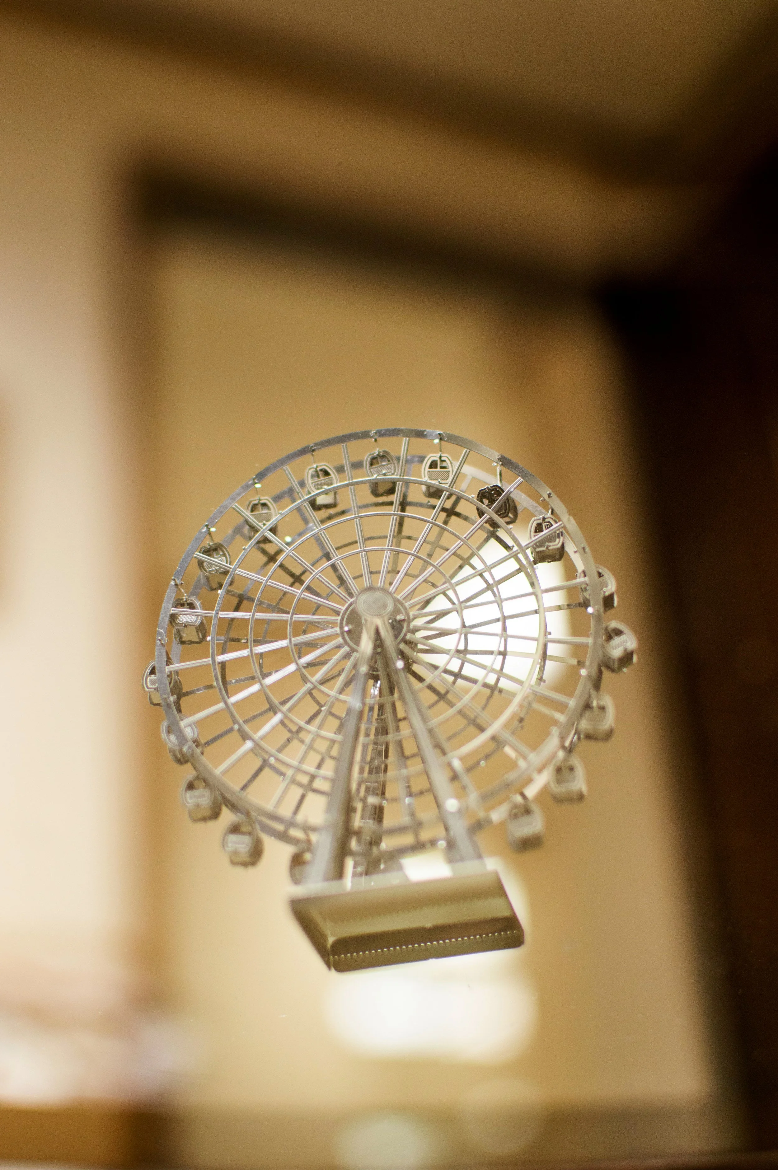 Riley Johnston, "Up & Around," 2019. "My dad and I put this ferris wheel together when I was little. He keeps it in a prime spot on his shelf at work, among other knick knacks from over the years."