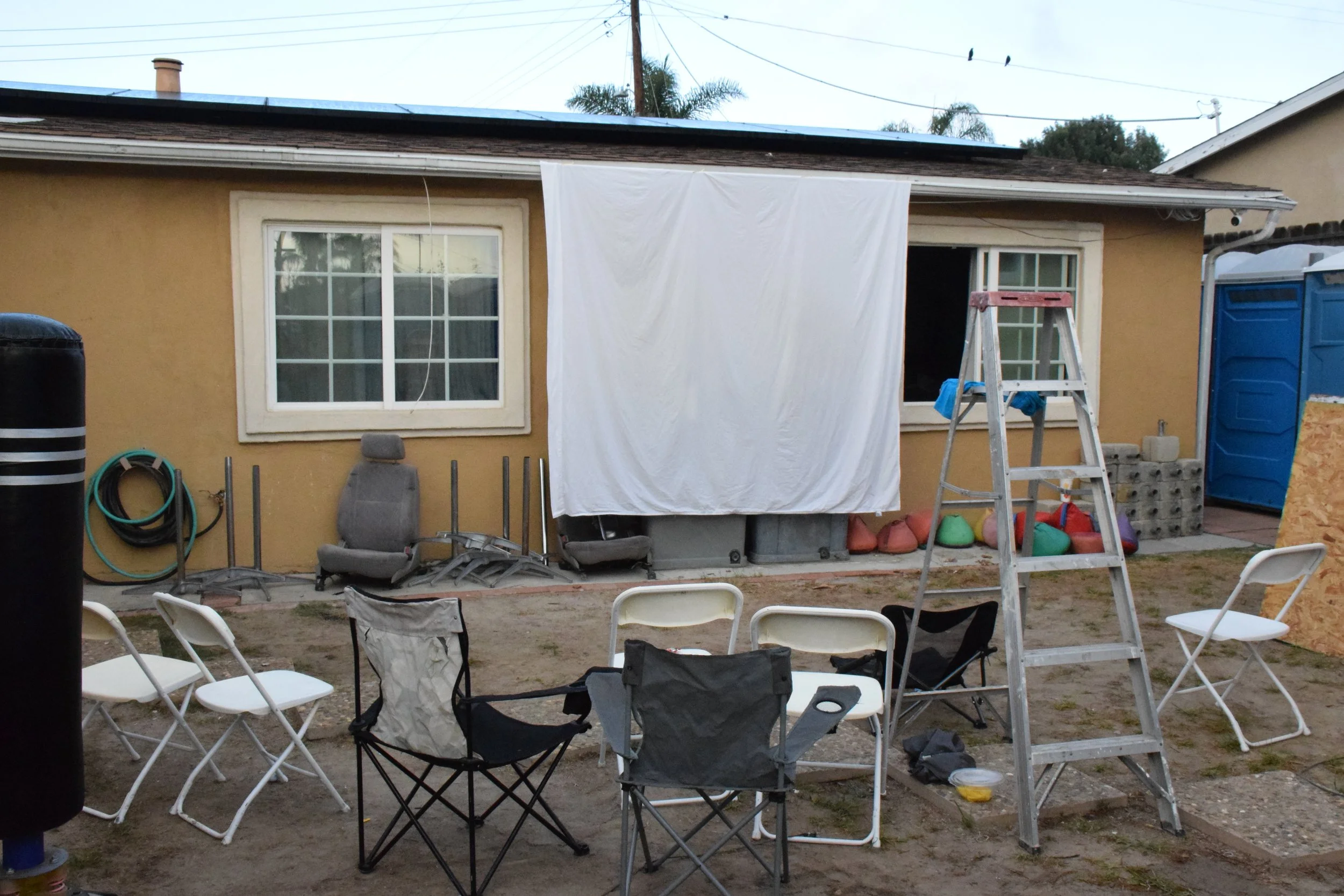 Angel Molano, "Theater," 2022.
This photograph shows how my family got together to watch a movie on Halloween night. It represents how close we are, getting together, but it also shows a sense of loneliness once everyone’s gone.