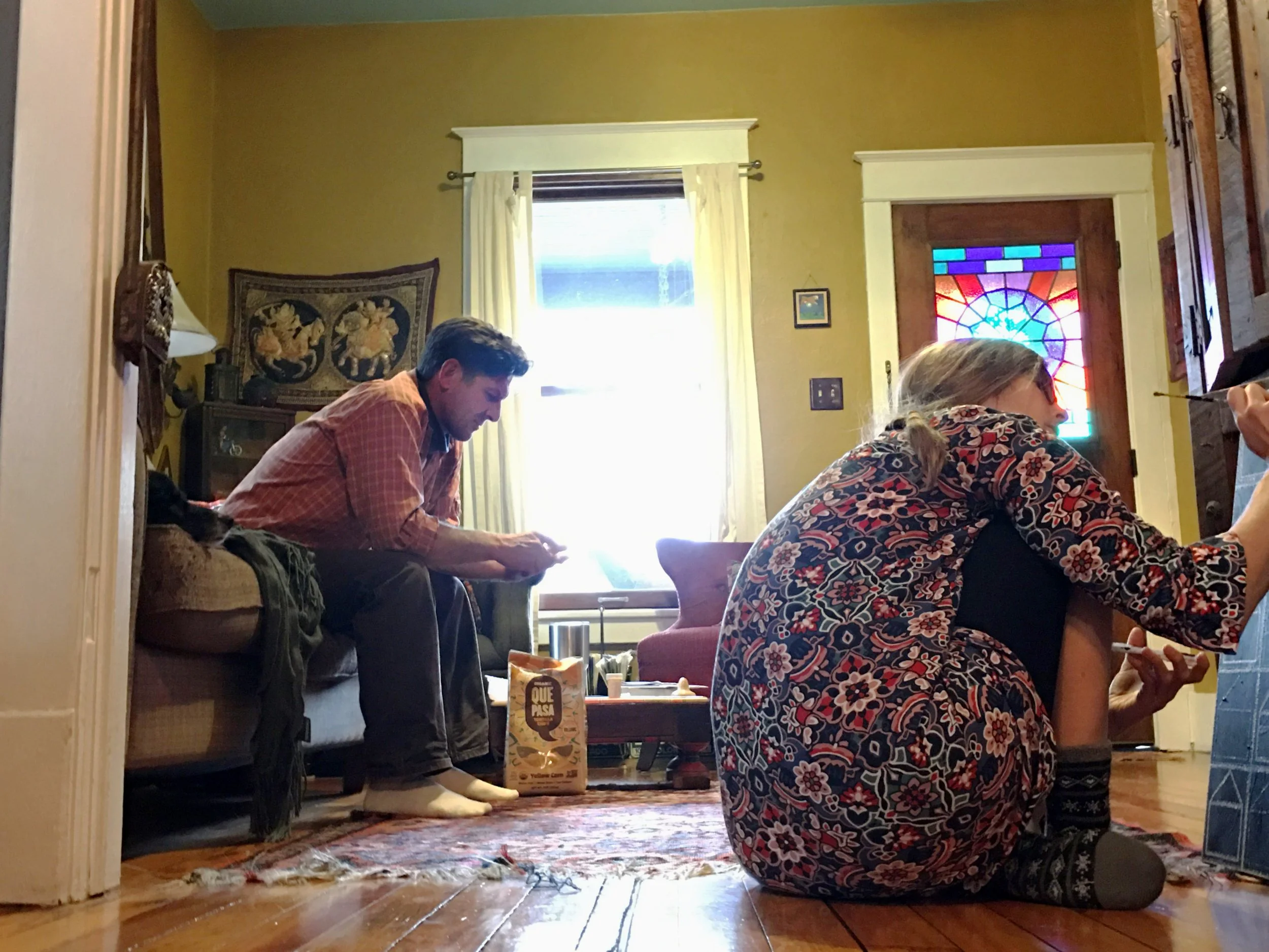 Maya Beck-Kjer, "Lazy Sunday," 2019. "After a long week of hard work, my parents always choose to take a few moments to relax. My mother paints, using a somewhat arduous process of pointillism, which relieves the stress of her high-demand job. My fat