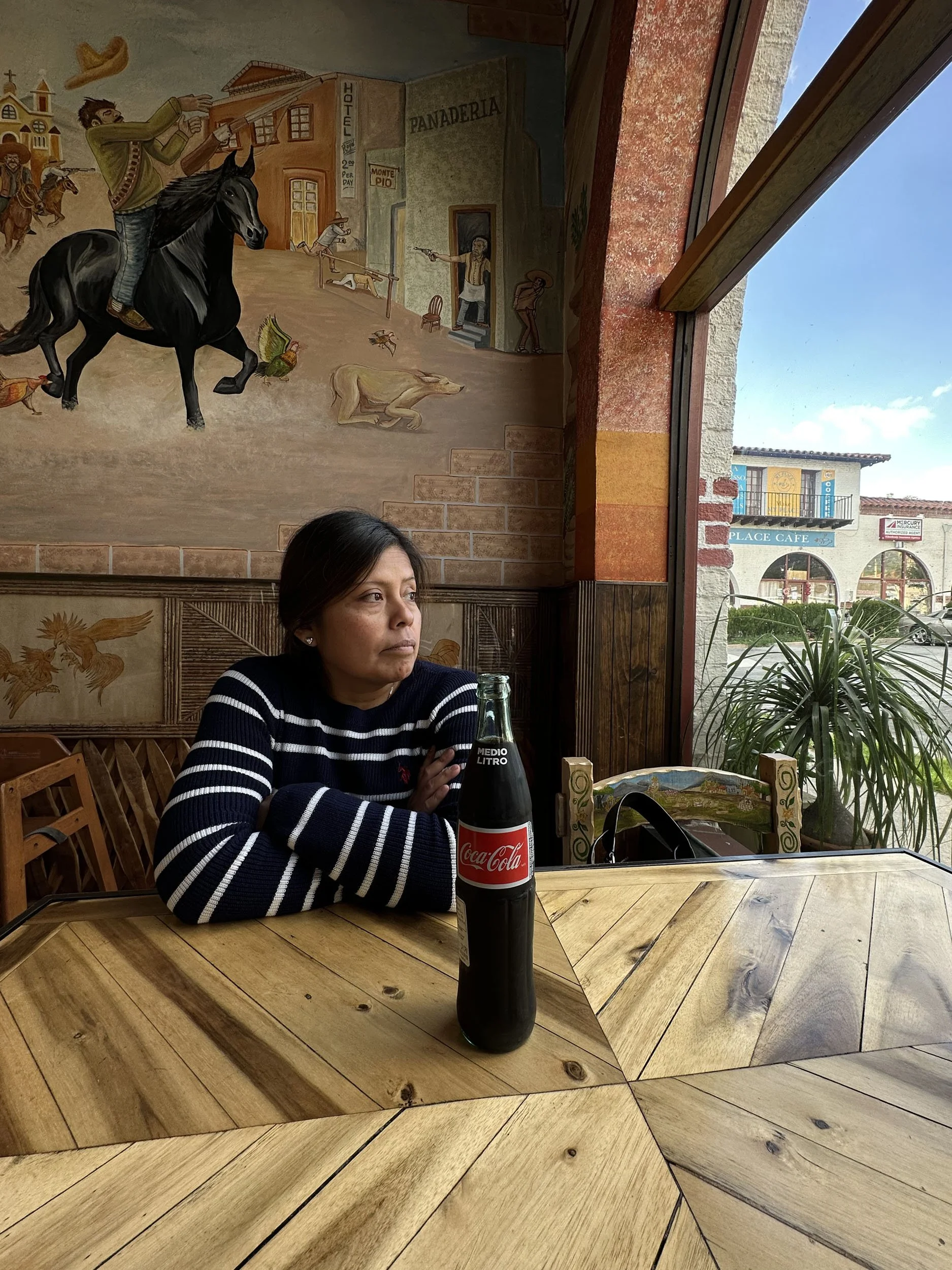 Amanda Rosales, "Order #11," 2023. My mom patiently waiting for her food after working on a weekend.