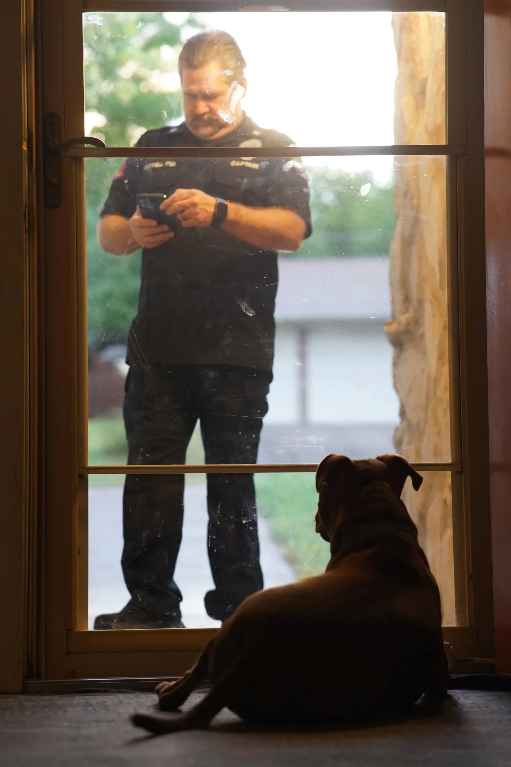 Harper Maxwell, "Front Yard Emergency," 2026. My dog, Olive, waits at the door for her favorite member of the family to come back home. My dad often tries not to bring what he does for work home — my mom hates hearing the traumatic stories from his d