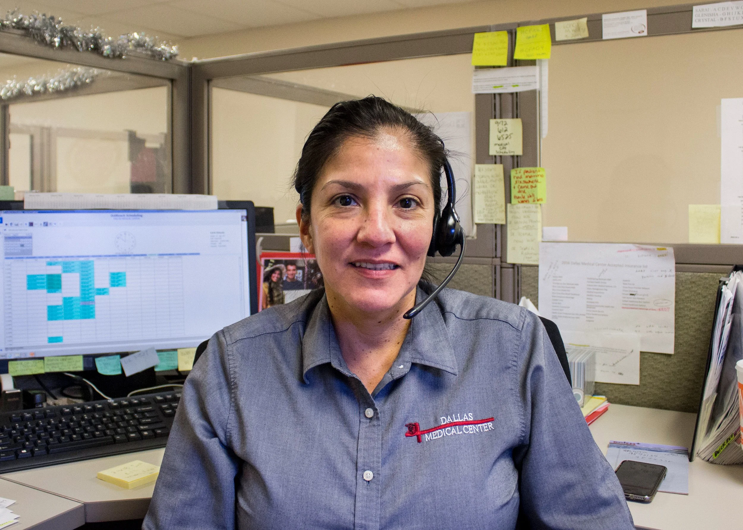 Madison Williams, "Untitled," 2018. "This is my mom, Mary. In this picture, she’s at her desk at work wearing her uniform. My mom is a scheduler for Dallas Medical Center. She works hard and brings so much joy to the workplace as well as at home."