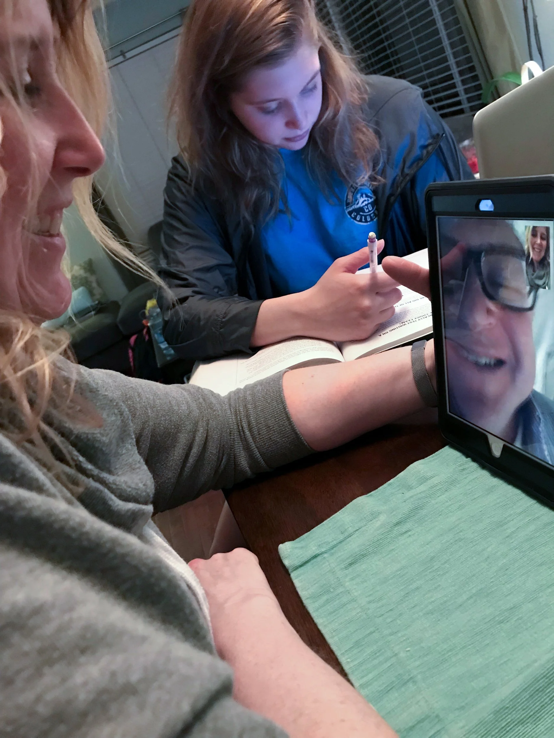 Lara Franco, "Busy Nights," 2018. "My mom is using FaceTime to talk to my dad who's away on a business trip, while my sister tirelessly works on her SAT prep preventing her from chatting with our dad."