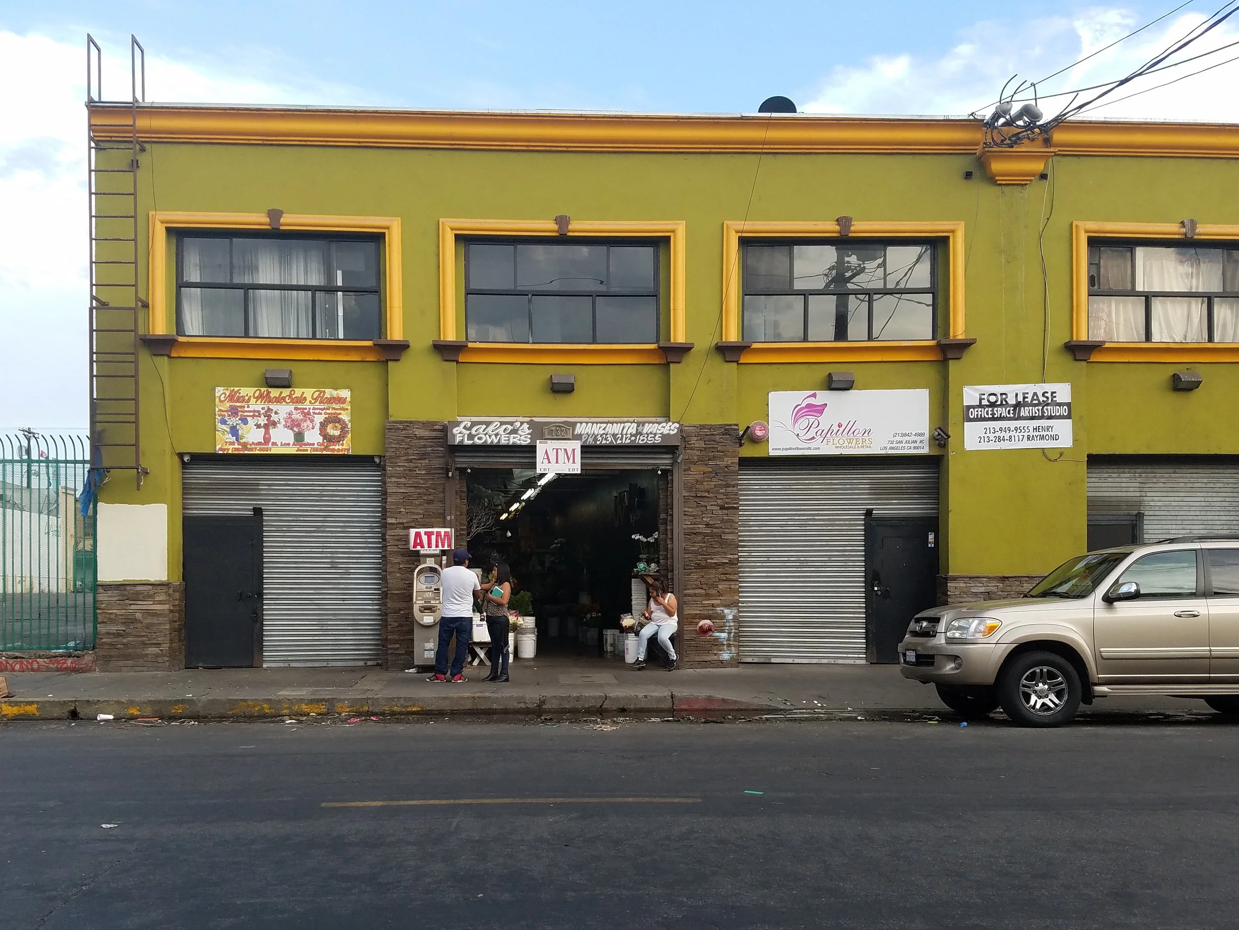 Ashley Dionicio, "The Shop," 2017. 
This is my mom's flower shop in Downtown L.A. We are the only shop still open and I’m impatient to leave.