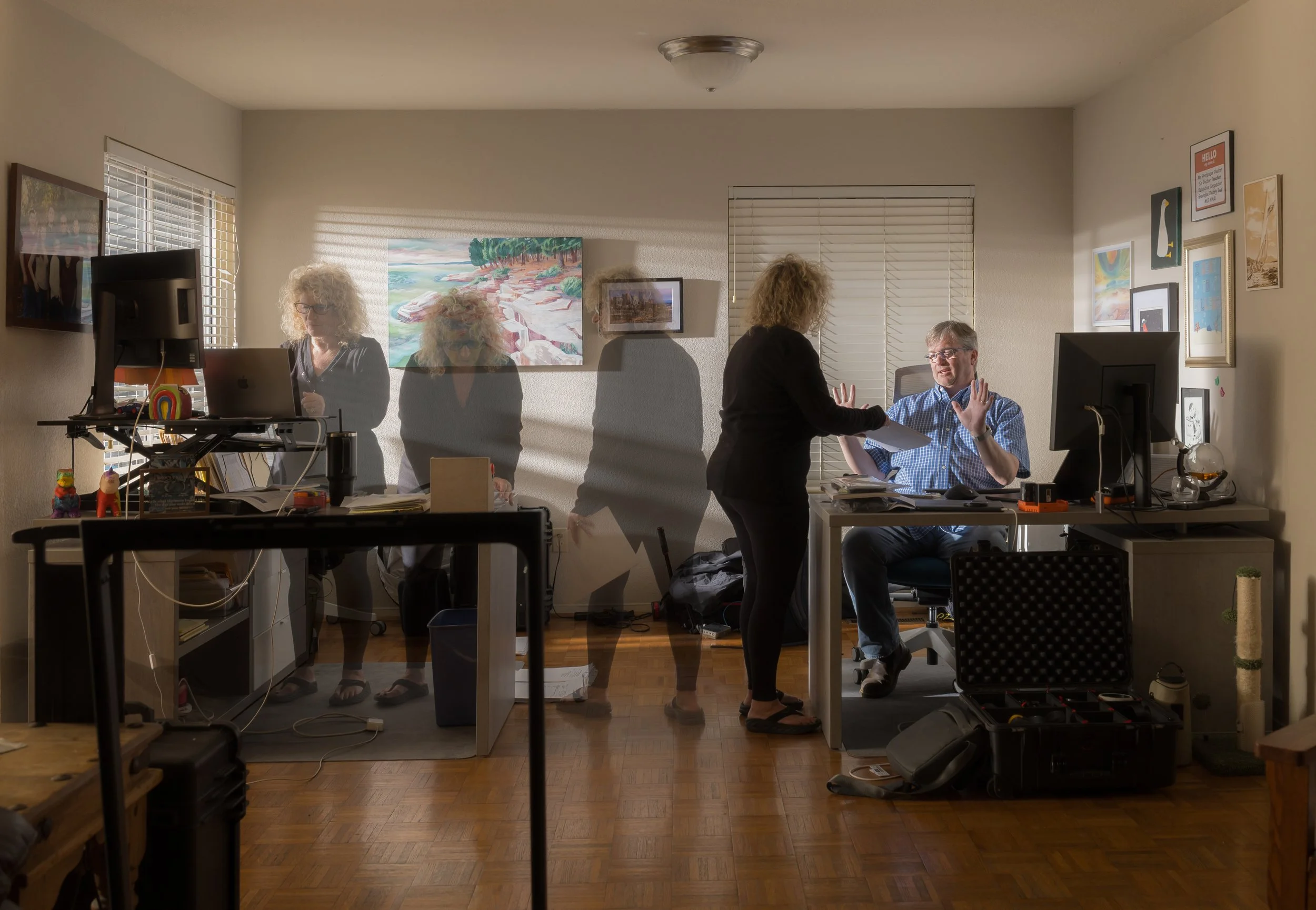 Joseph Purtell, "Working Flow," 2026. My mother (left) and stepfather (right), both working from home. Mother is a legal secretary and also assists in managing my stepfather’s photography business, printing and filing documents in a digital age, and 