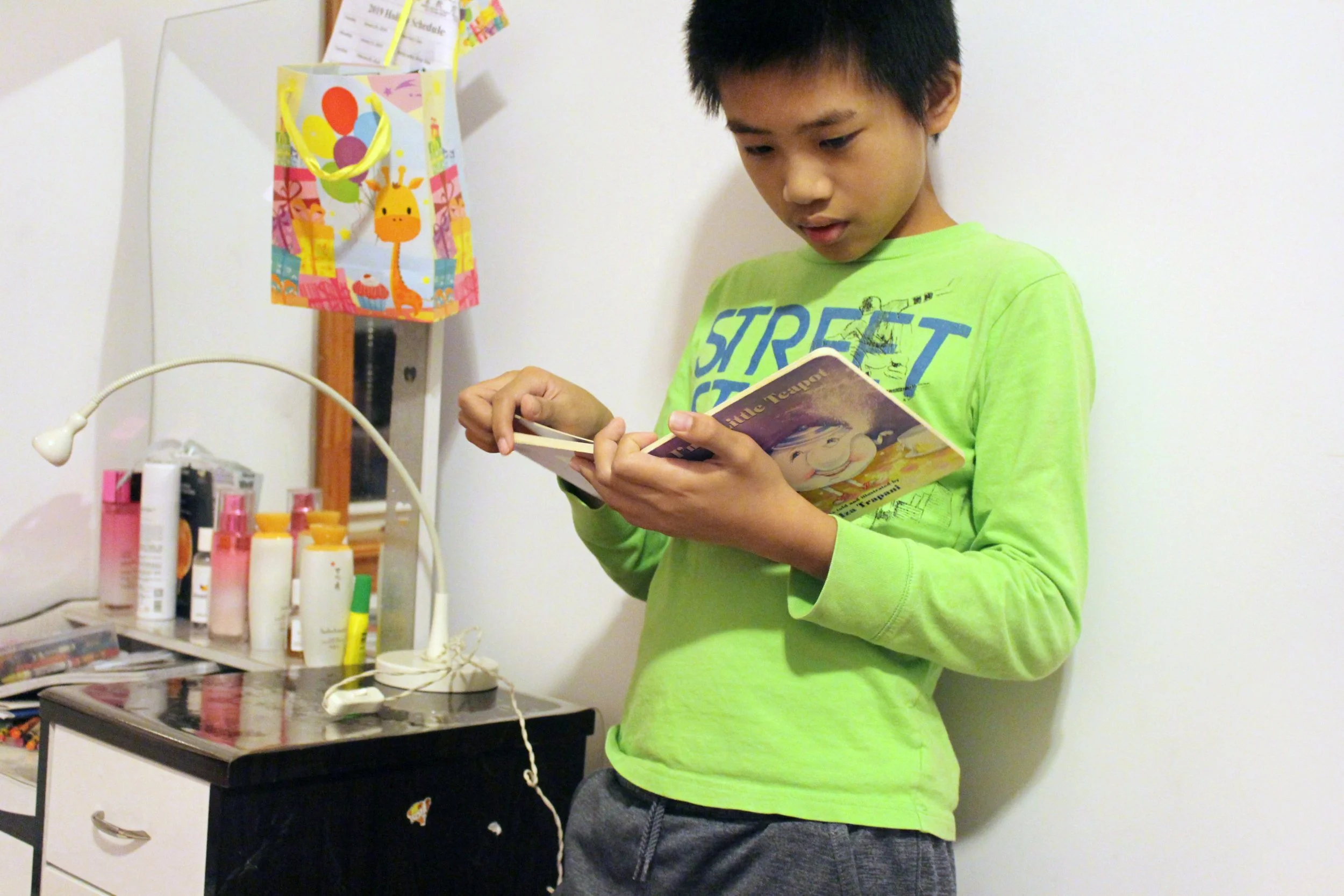 Joey Zou, "Reading," 2019. "Peaceful time. Reading time. Without any noises, we can all do anything. Just like books, pages full of words, slowly it’s gone because we finished the book."