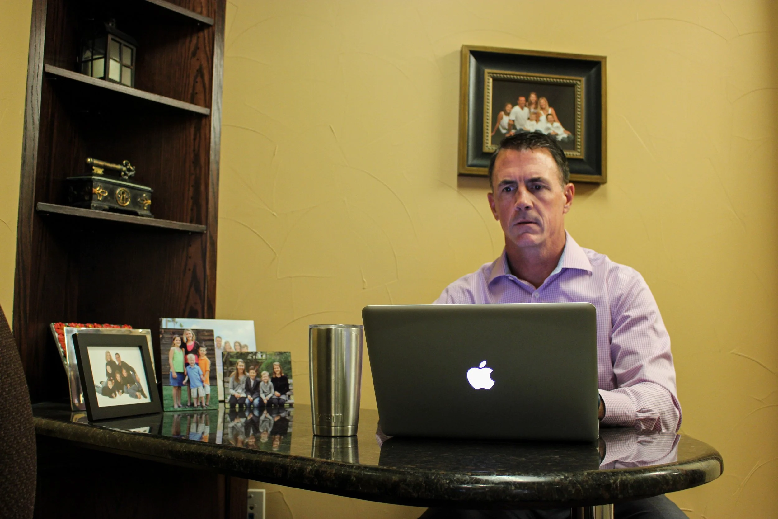 Hannah Ryan, "With Family in Mind," 2018. "Working in an environment with kids everyday, my dad is constantly reminded of family. While he sits at his desk, he is visually surrounded by his family."