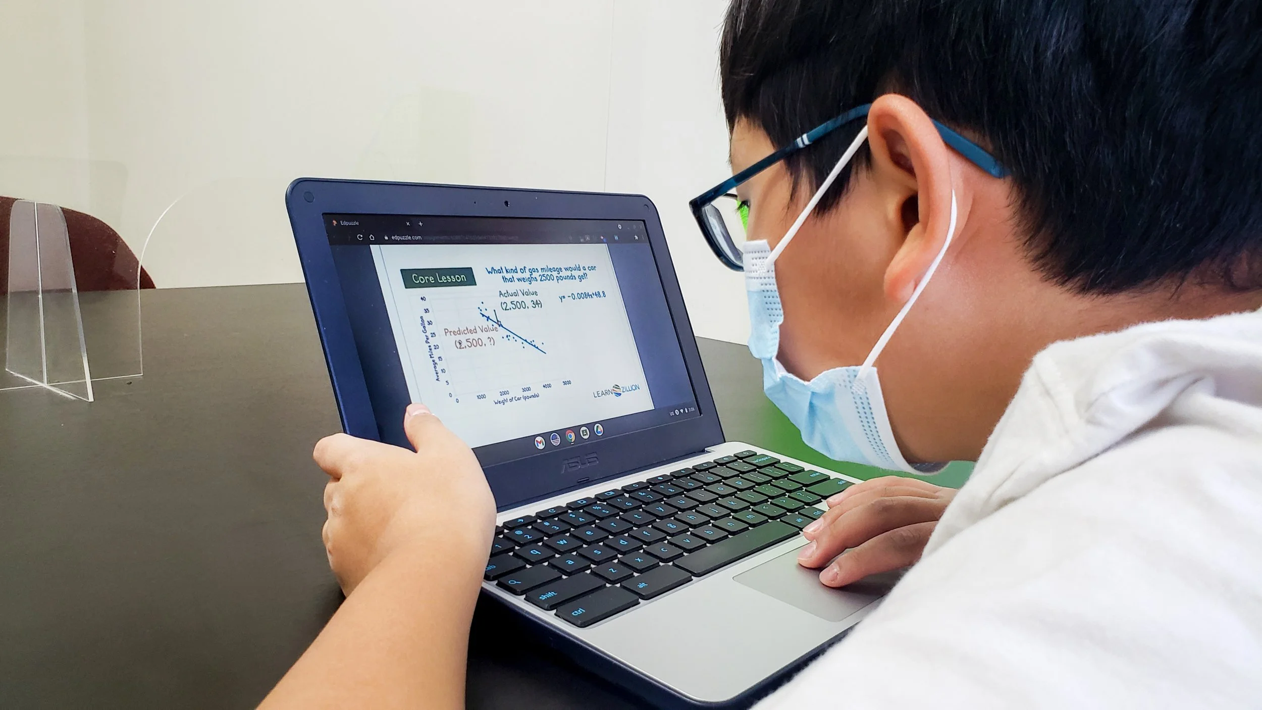 Phillip Han, "Focused," 2021. My brother is very focused during class; he hates being distracted. Also, he is always working hard to keep his grades up. It was very quiet, almost no noise, as he was trying his best to focus, so I had to be quiet.