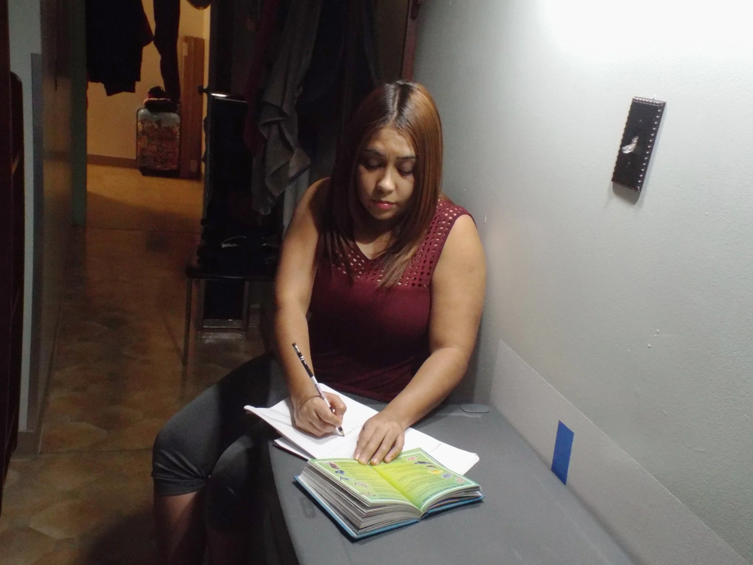Carline Almonte, "Aunt Reading and Writing," 2019. "After reading for a good 35 minutes, she starts to write what she reads so she won’t forget. My aunt always tells me that when I read it helps me stay calm, and it’s true, because she is always stre