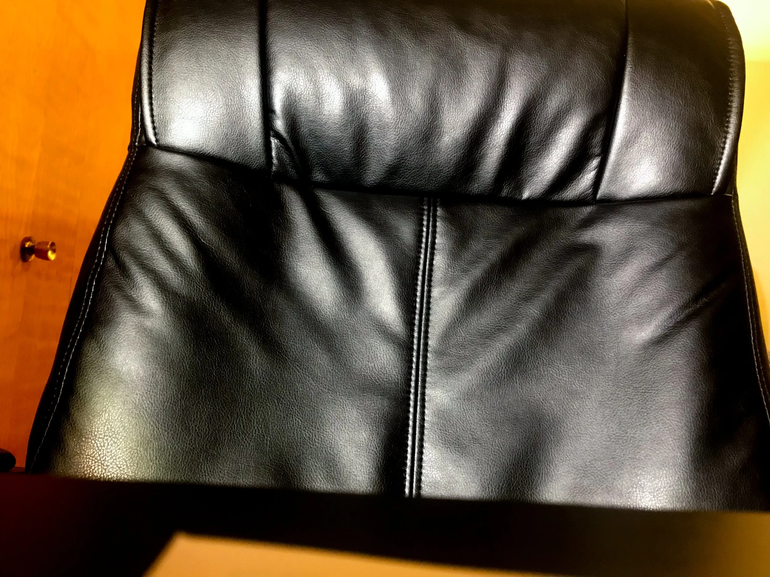 Benjamin Teixeira, "Empty Portrait," 2021. I imagine the room was filled with the smell of vinyl and the sound of distant eating, but I wouldn't know. This chair is where I usually work, and I've left it empty to go spend more time with my family.