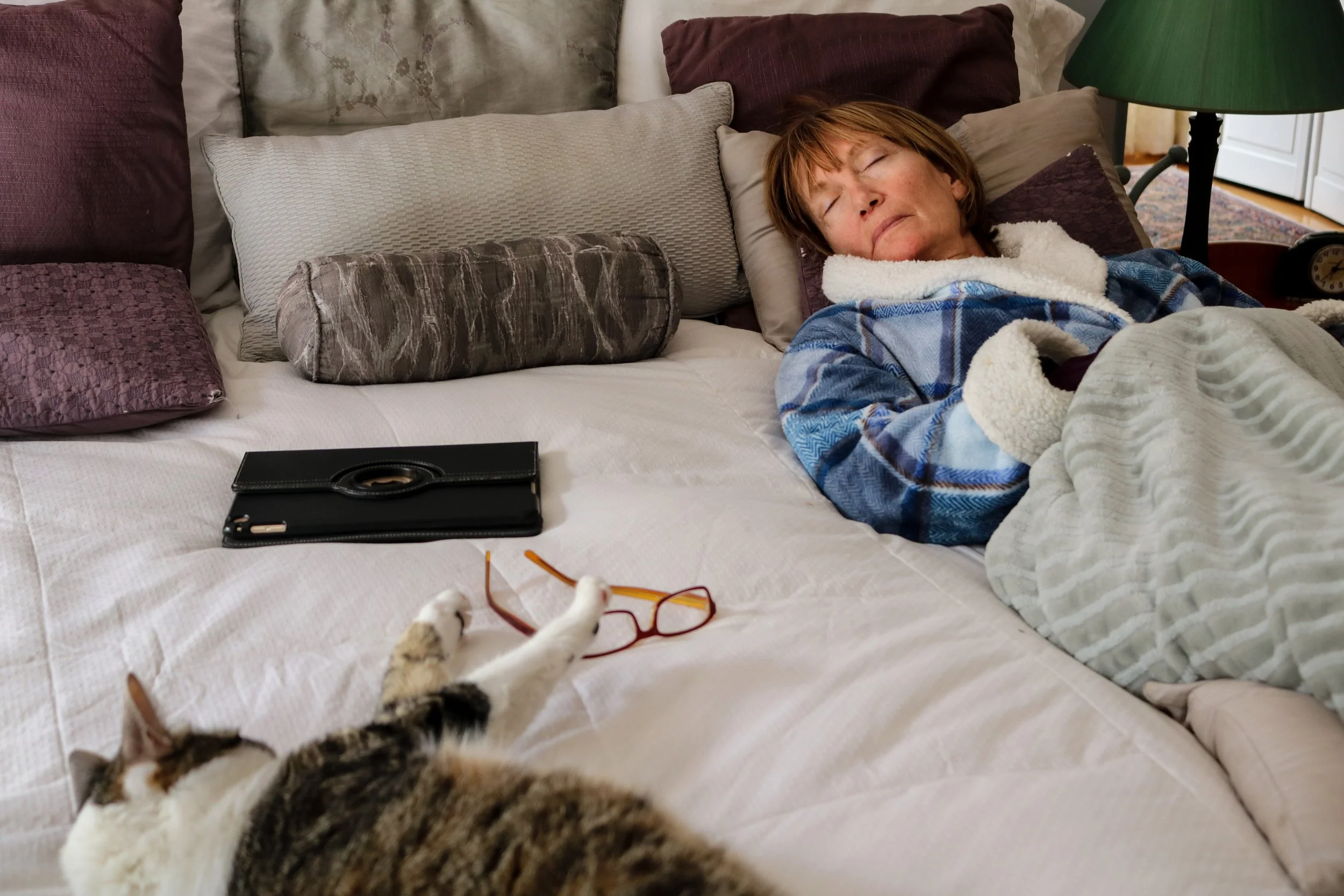 Tessa Olivieri, "Sleeping Mom in Blue," 2018. "My mom gets so exhausted taking care of me and my brother all day and sometimes she just crashes. Even when she is asleep, our cat still wants to play with her and get her attention. Her iPad and her gla