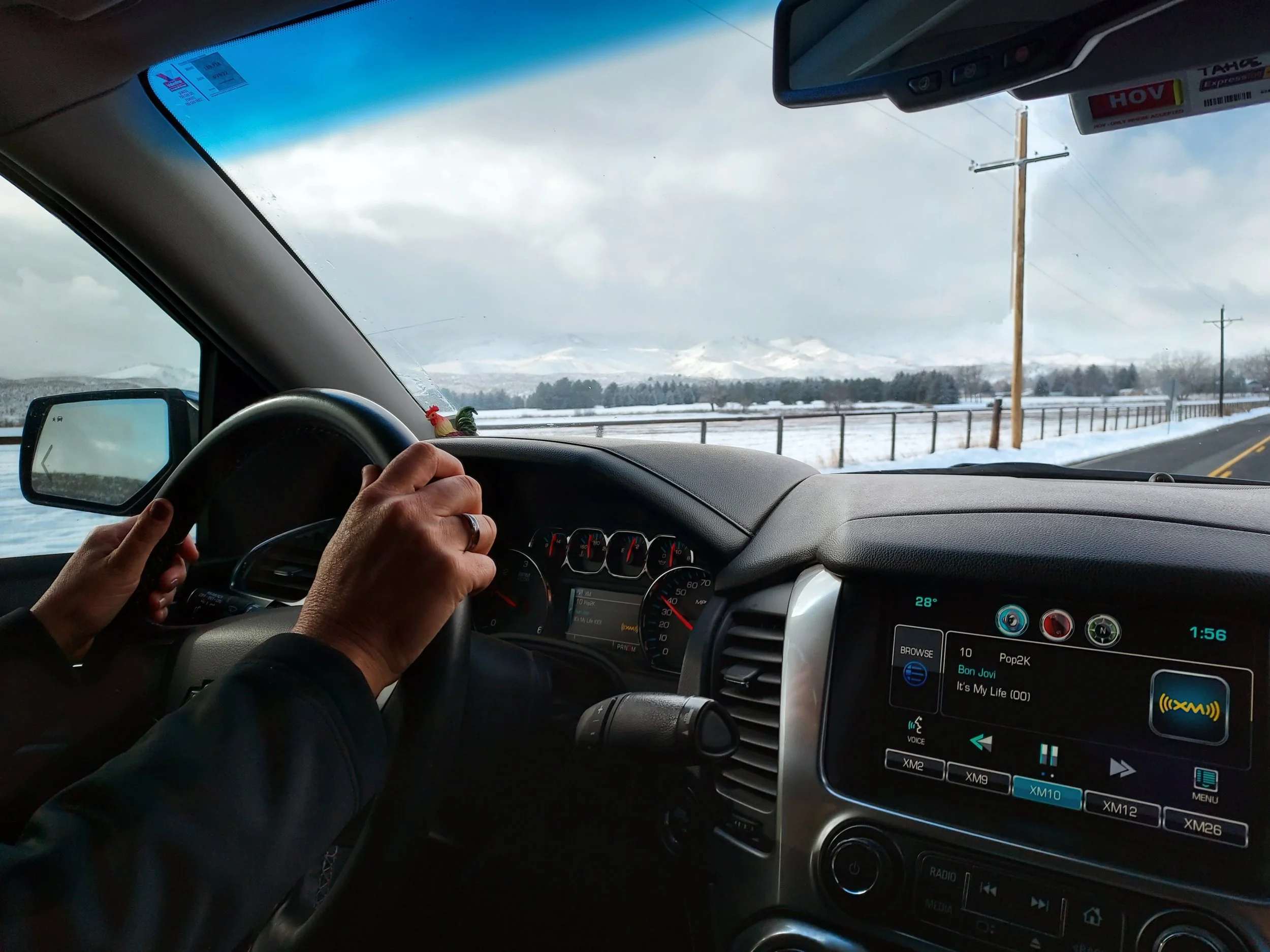 Madison Sonntag, "Bingham Hill," 2022.
In this photo, my mom is driving down Bingham Hill after taking me to get a COVID test. While we were driving over the hill, I really noticed the sky and how gloomy it was. Normally I wouldn’t have thought about