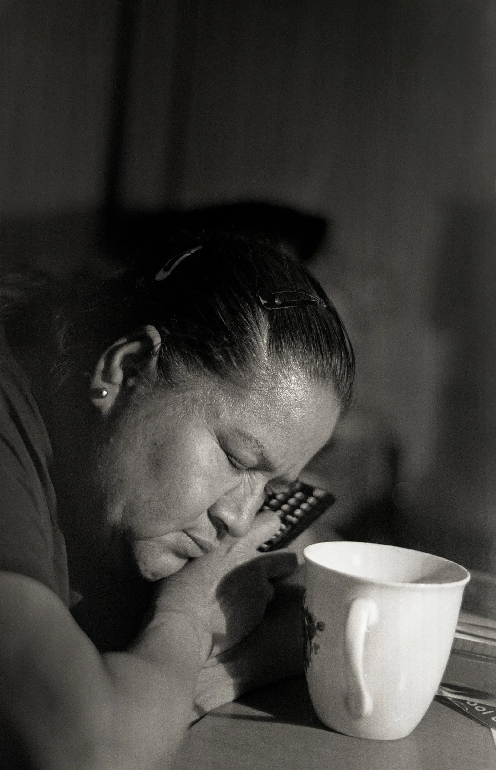 Brigitte Cruz, "Endless Nights," 2018. "My mom is overpowered with fatigue. By the time she is finished work, she has a small amount of time left for herself. She likes to spend that time drinking tea or coffee while watching the news. Most of the ti