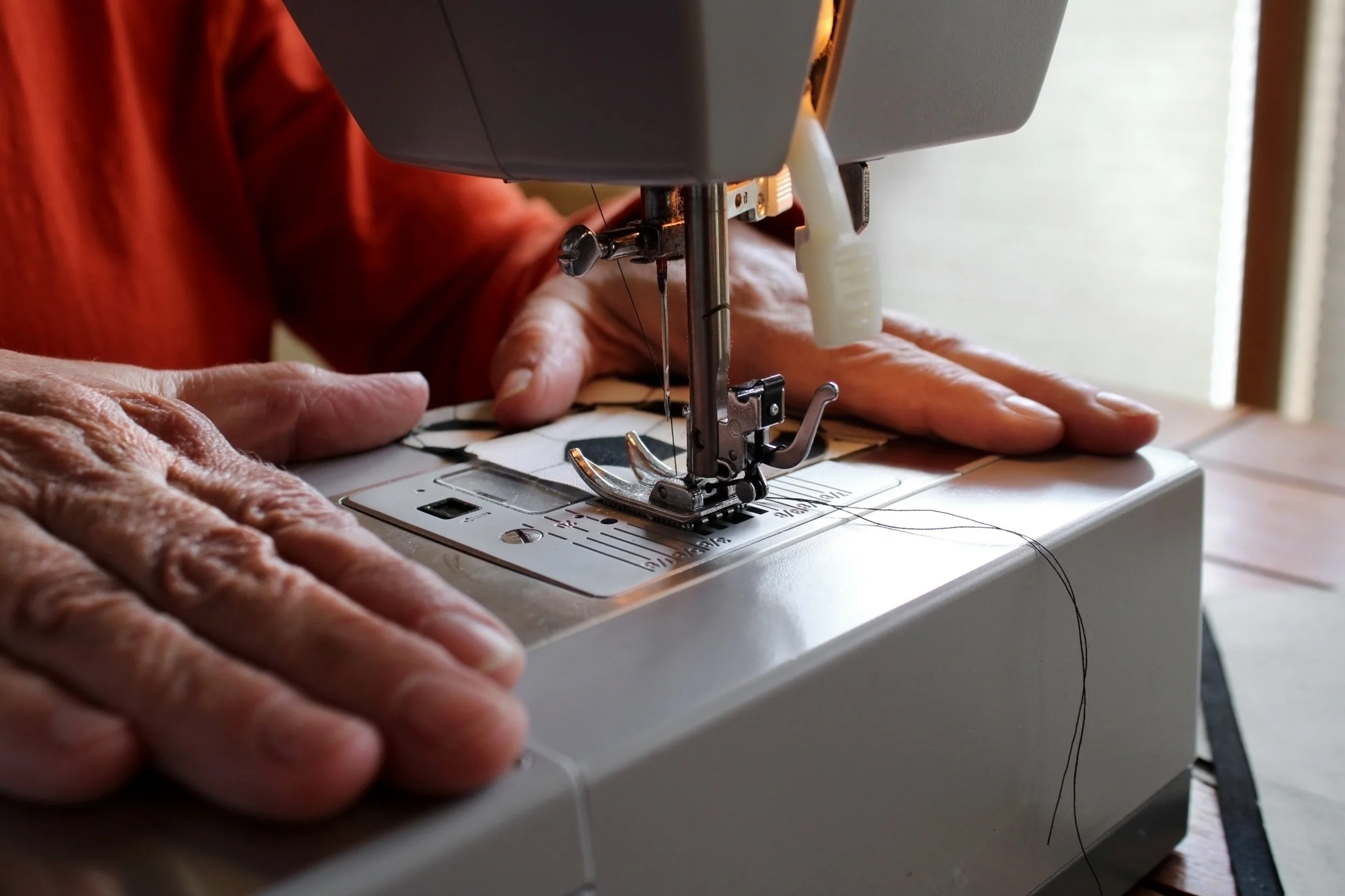 Ellison McGrew, "Hands," 2021. Sometimes you can tell a lot about a person by their hands, age, hobbies or work. These hands are the hands of a mother, a grandmother, and a quilt maker. A tradition in our family is that my grandmother makes a quilt f