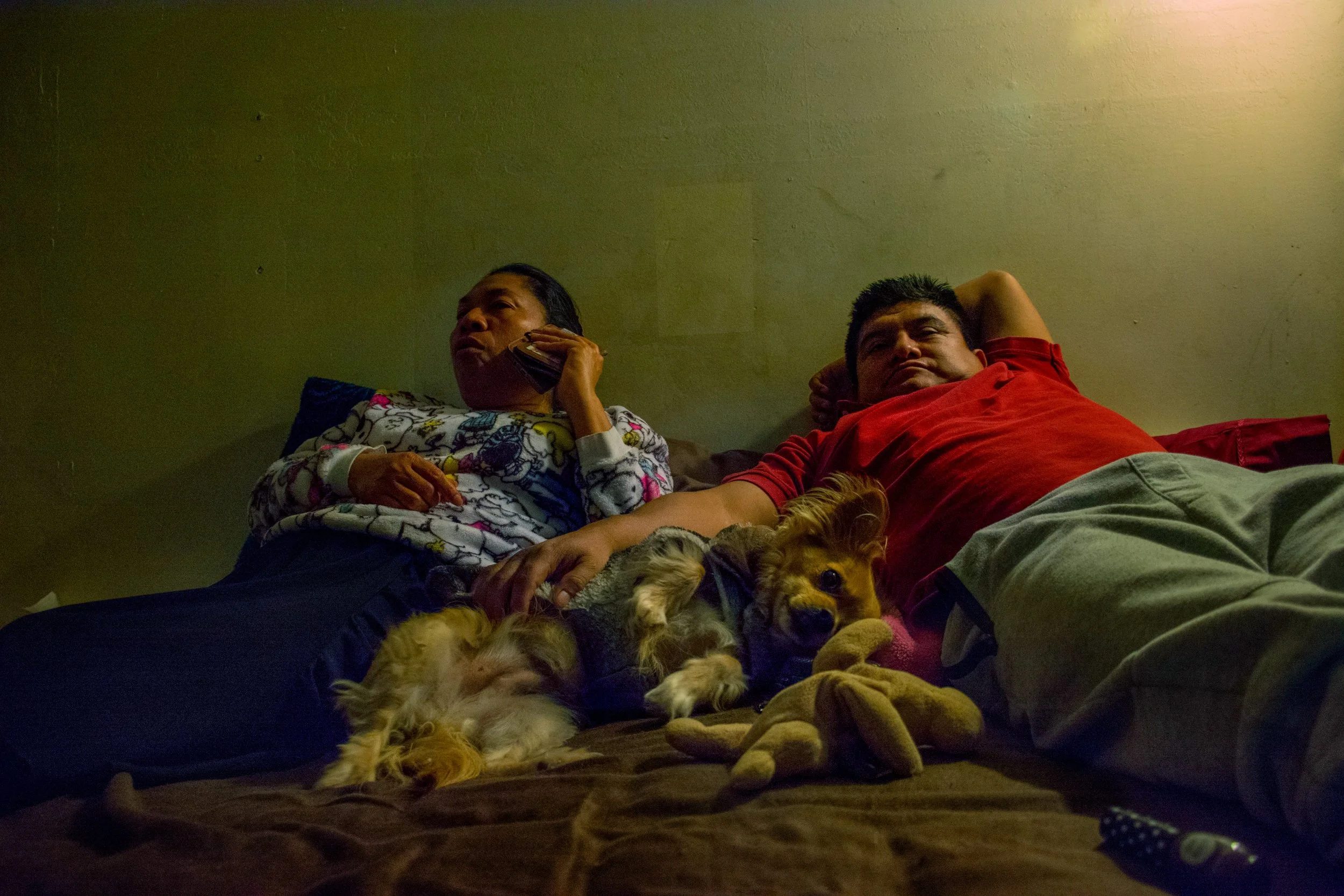 Andy Paxtor, "No Time," 2018. "This happens at the end of every day. My mom and dad lay down and watch TV to relax. You can see my dad doesn’t have much energy, he’s exhausted."