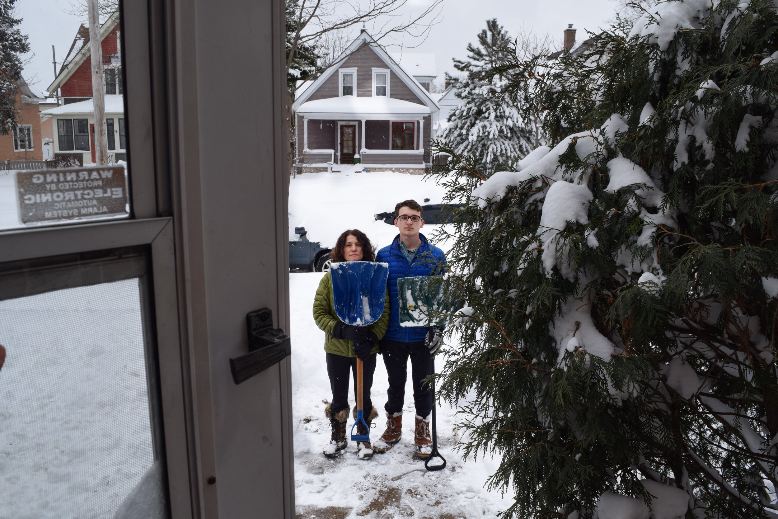 Libby Cohen, "Untitled," 2018. "My mother and brother shovel the dreaded April snowfall together to make the driveway and sidewalks accessible for our family. They work together to make it a fun experience, enjoying each other’s company. This image m