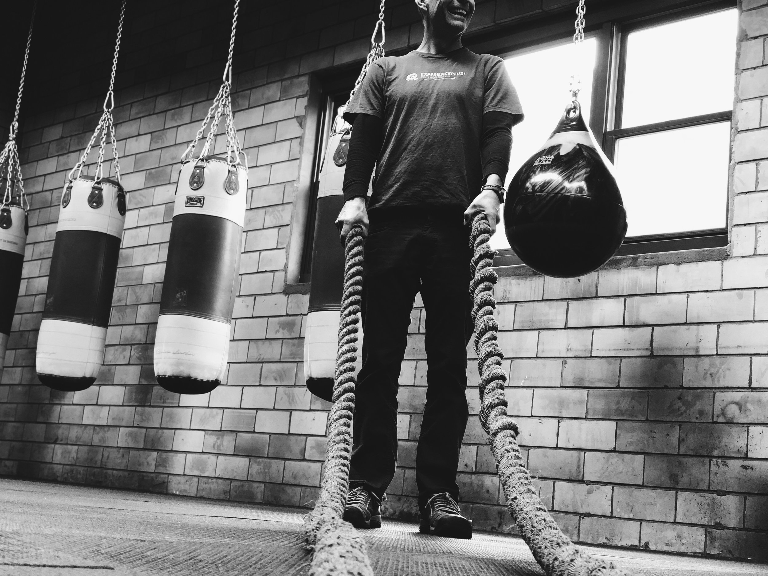 Lindy Hickman, "Untitled," 2018. "The picture is taken at the gym my dad owns, where he is the head coach. In this image, my dad is holding big training ropes. His smile signifies his passion for coaching."