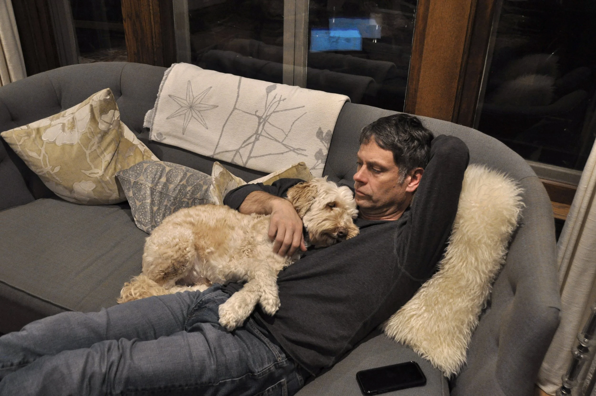 Grant Mortenson, "A Break," 2019. "It's a story told time and time again: dad doesn't want a dog, but once the family gets one, it's his baby. When my dad finishes his work, he instantly snuggles up with the dog and rests. It really is his first brea