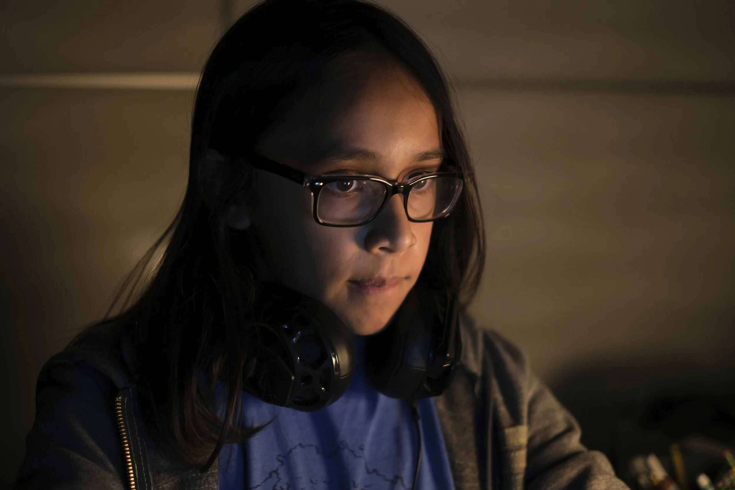 Yasmine Martinez, "LateNight-Video-Games," 2022.
Late at night on school nights, my brother, Elai, plays video games with utmost concentration as he and I wait for my mom to come home from work. The house is mostly quiet, and even though we are in th