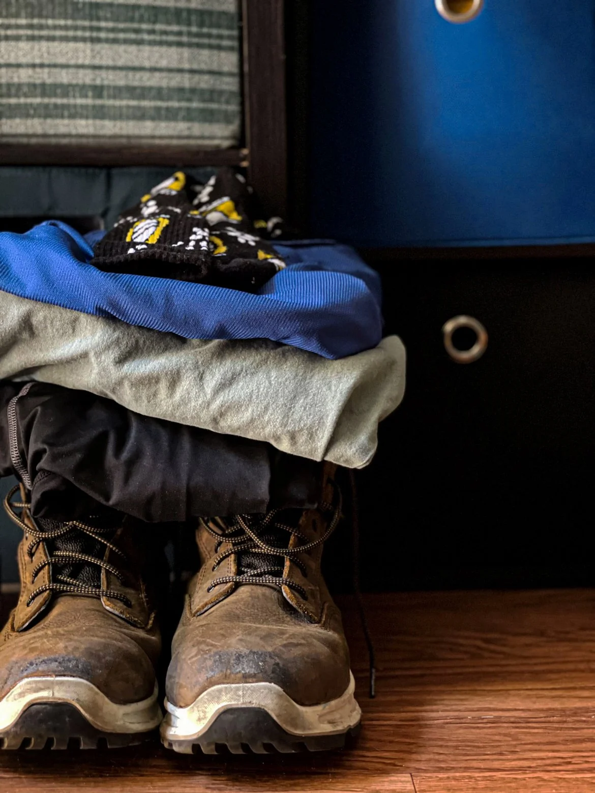 Isabella Hernandez, "Another Day of Work," 2021. Before my dad goes to bed at the end of the day, he prepares for his next day of work. He gets his uniform ready, prepares his lunch, and sets his alarm at 12:30 a.m. He does this every day, five to si