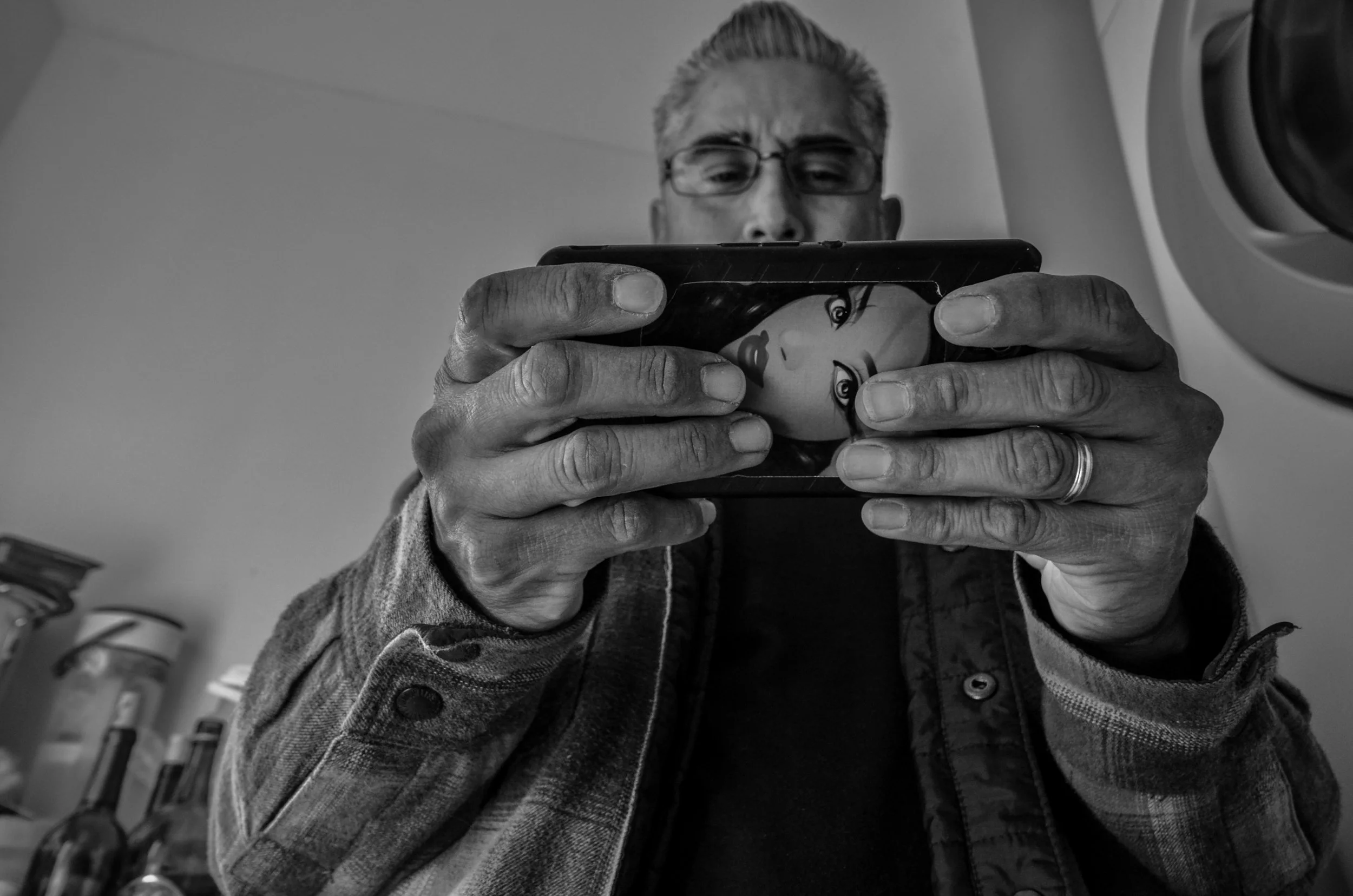 Yazmin Escamilla, "His Own Universe," 2018. "When he goes on his phone it’s game over. He gets lost in the worlds of YouTube and Instagram."