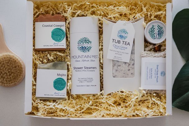 Open Serene Retreat Wellness Box displaying curated natural bath and body products for a calming at-home spa experience perfect for gifting