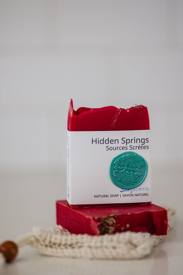 Labeled Hidden Springs bar soap standing upright, showing minimalist packaging and fresh seasonal scent branding