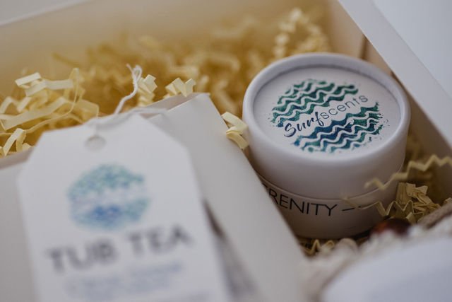 Tropical Glow dry clay face mask included in Serene Retreat box, shown in its minimalist packaging with botanical ingredients