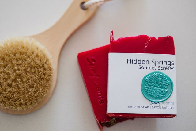 Hidden Springs summer bar soap styled in a flat lay with natural body brush, showcasing spa-inspired details