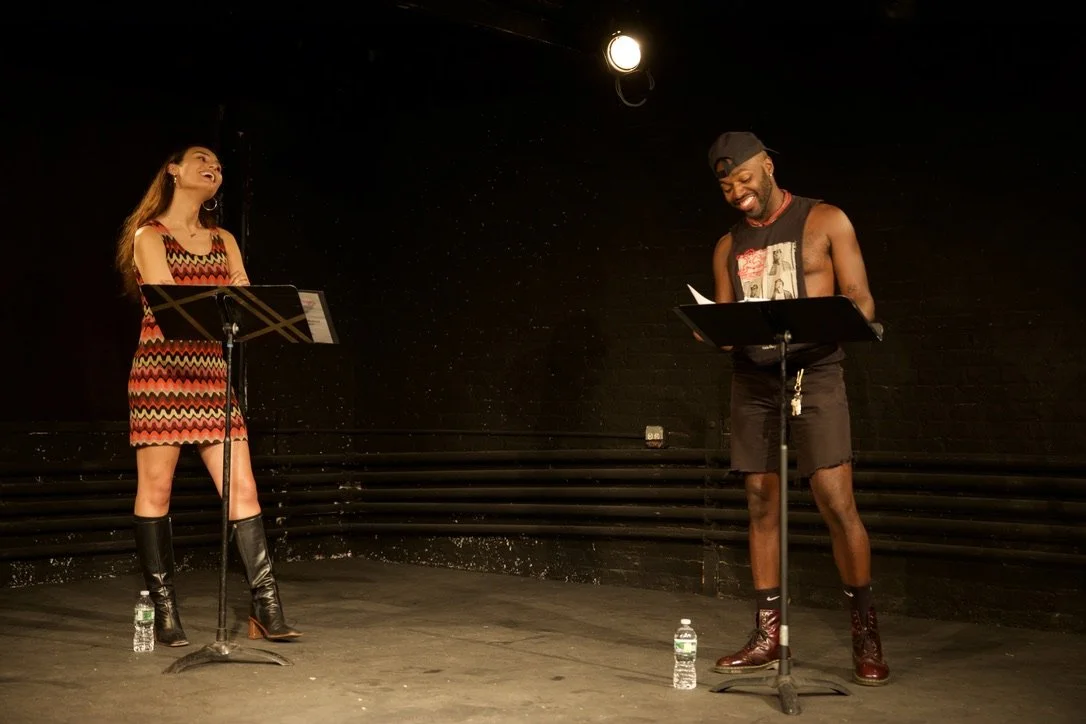Christine Carmela and Leland Folwer in LUX AND REX ARE THE BRIGHTEST THINGS (Checkmark Productions Summer Reading Series '25, Intar Theater. Photo by Danny Hidalgo).