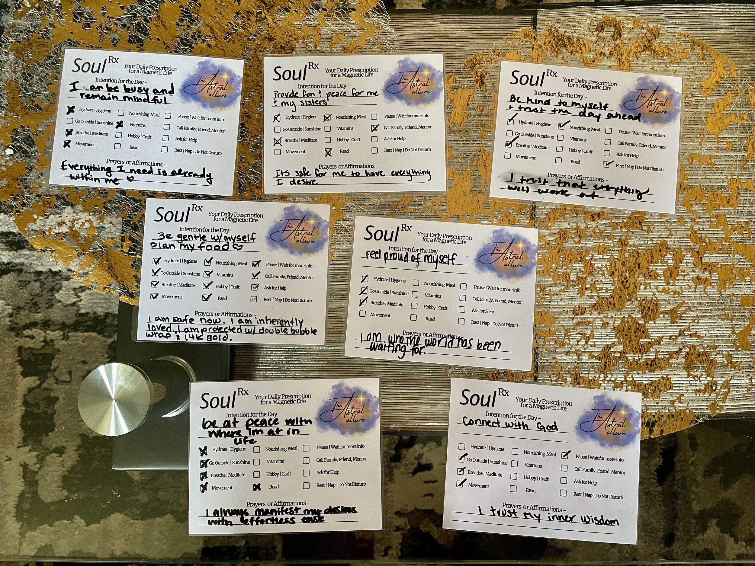 Image shows seven Soul RX cards, each with personal intentions and affirmations written on them. They include intentions for staying mindful, connecting with others, being gentle, and trusting oneself. Each card has options for self-care activities l