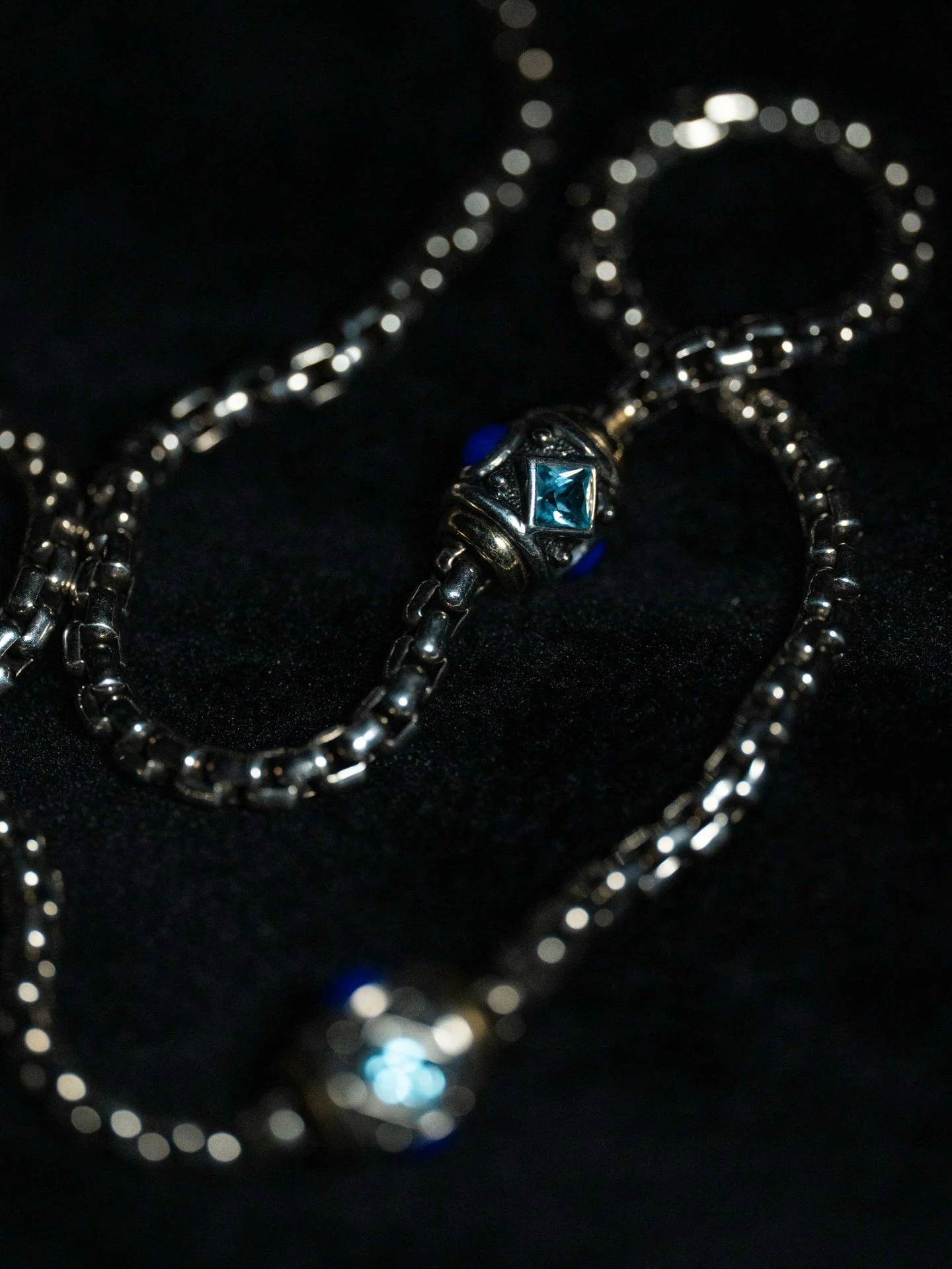 Design features a sterling silver box chain with ornate stations, each detailed with oxidized silver and set with blue topaz.

This style is a well-known classic within the brand's collections. Its signature craftsmanship and use of quality materials